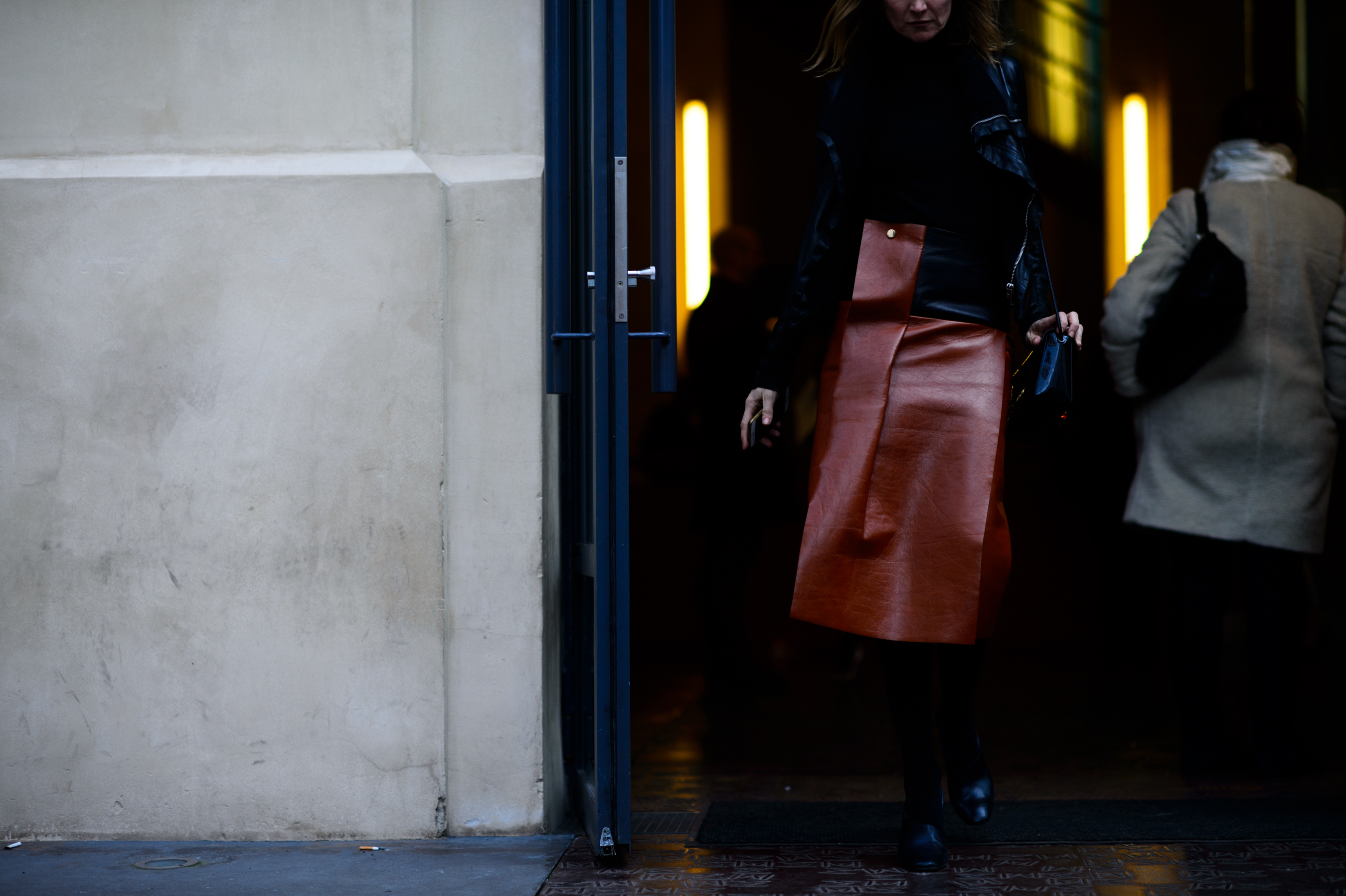 Woman wearing leather skirt