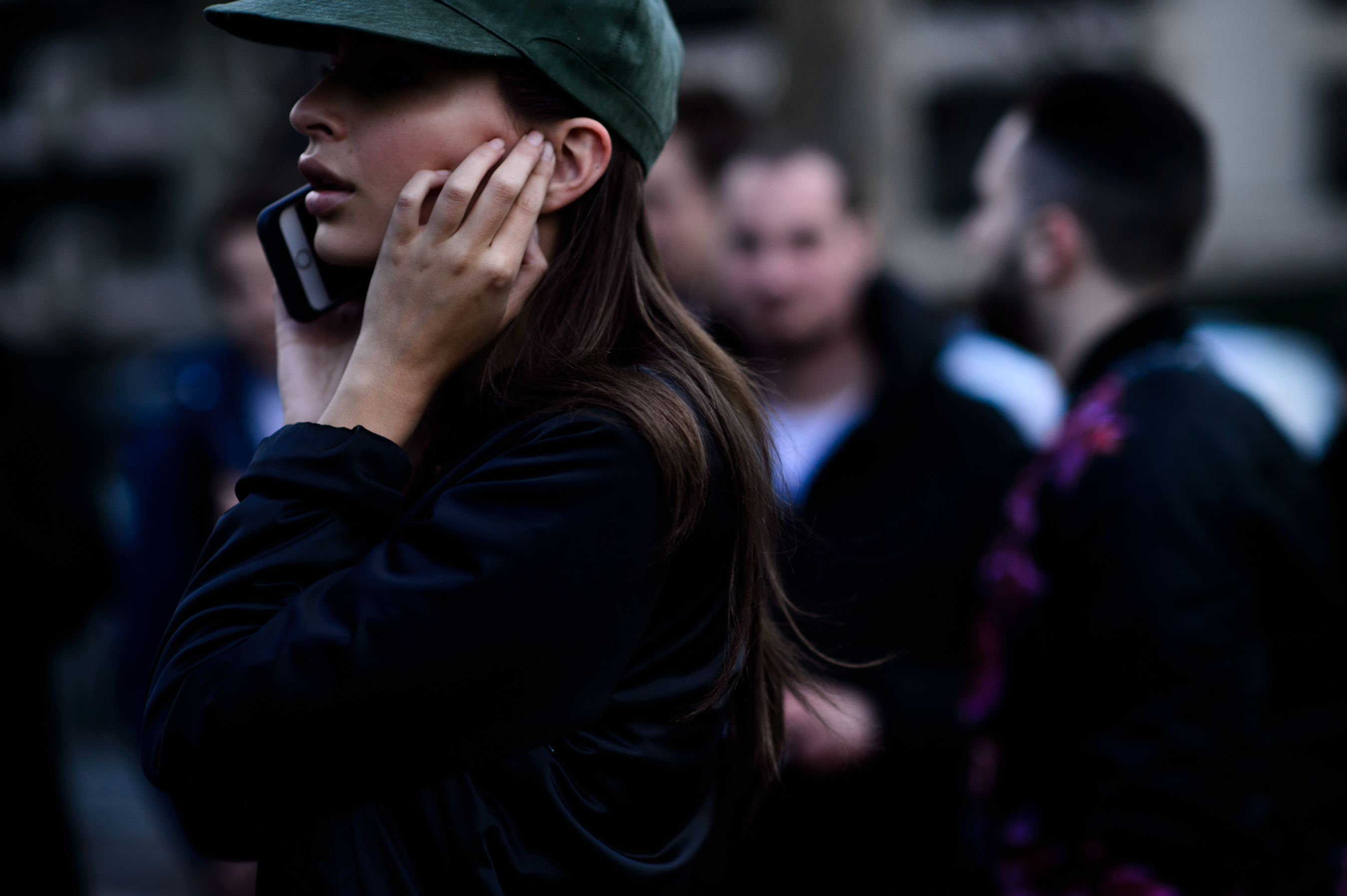 Model wearing green peaked hat