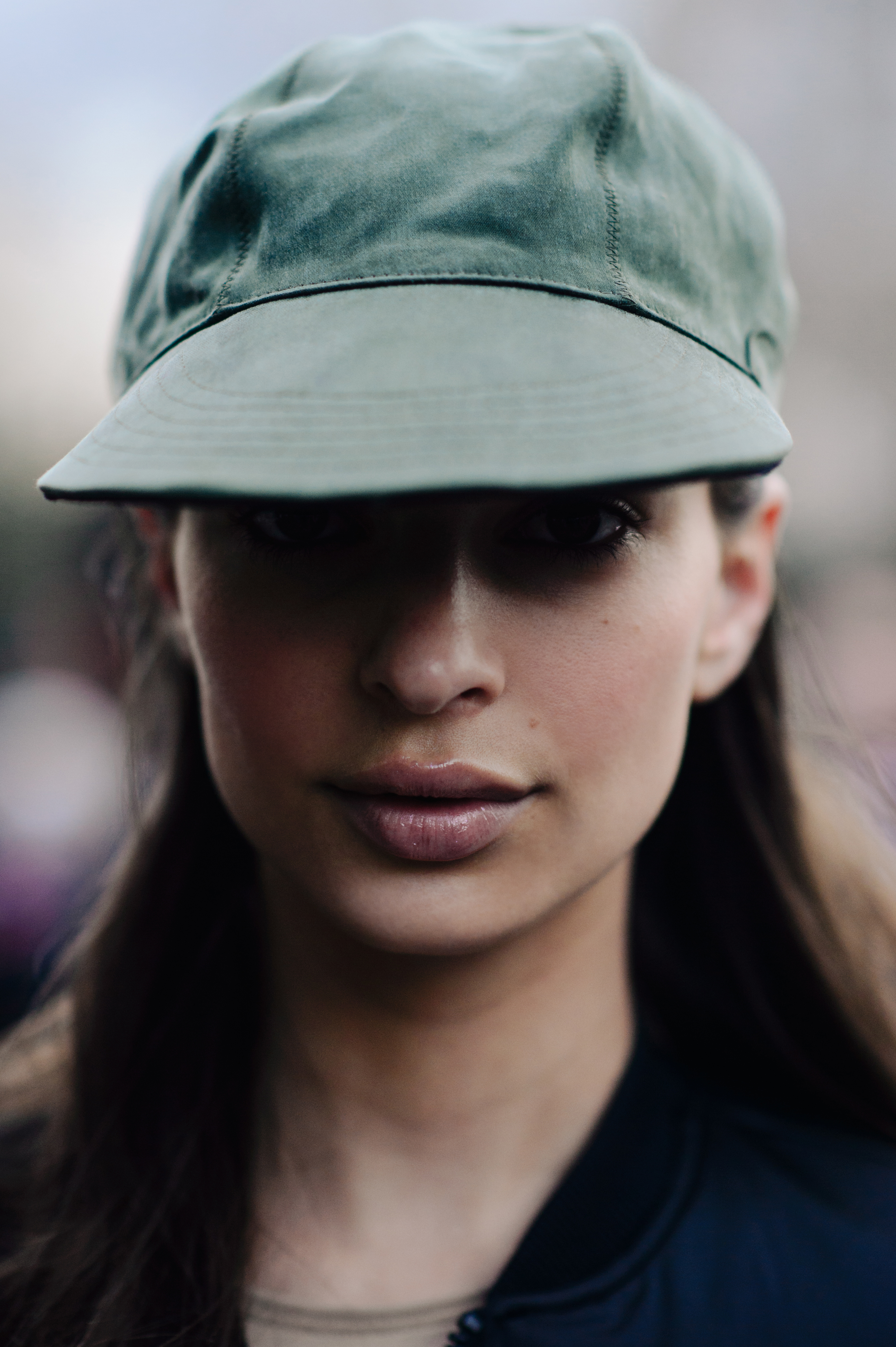 Portrait of model in green peak cap