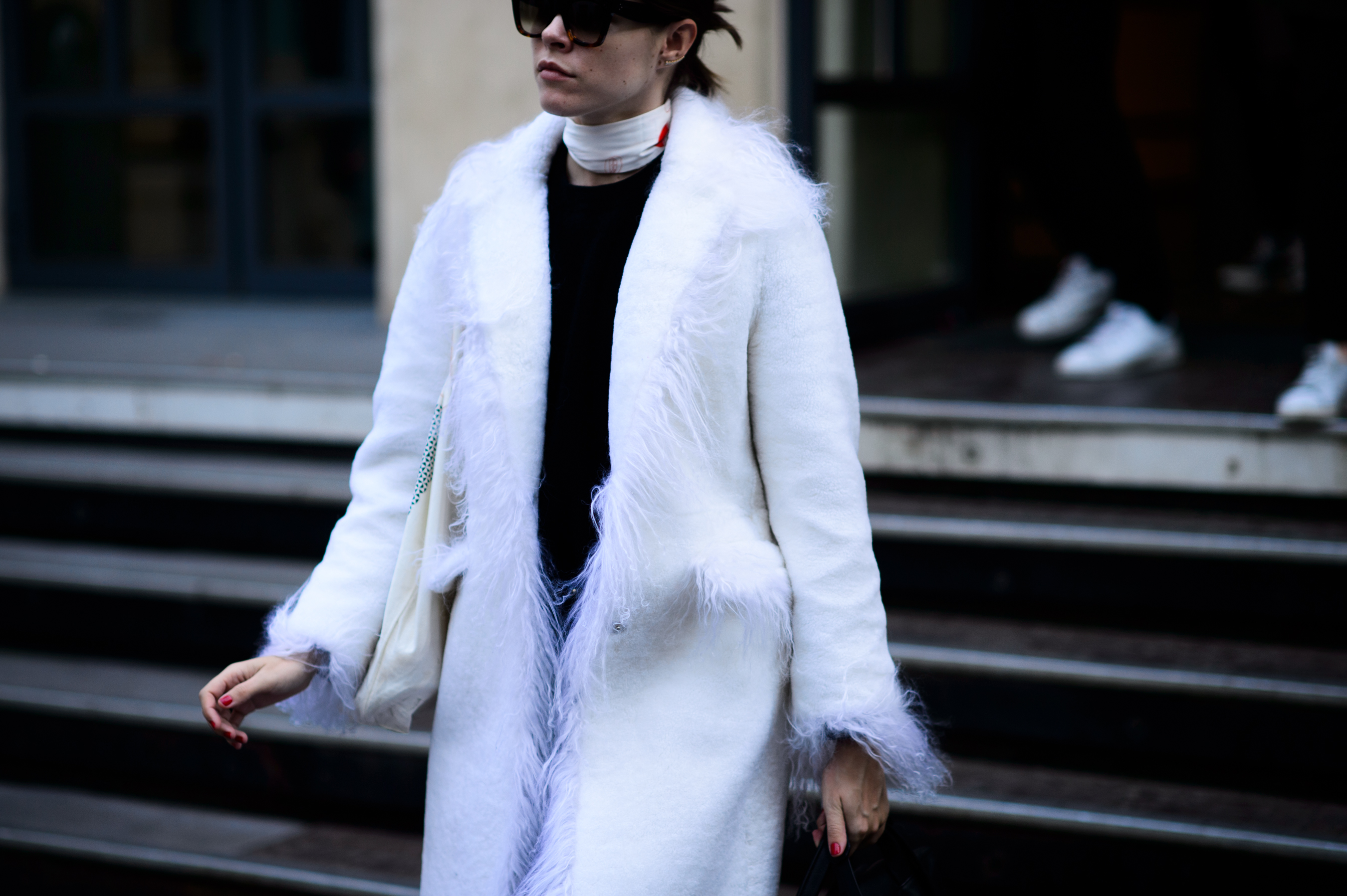 Woman wearing white warm coat