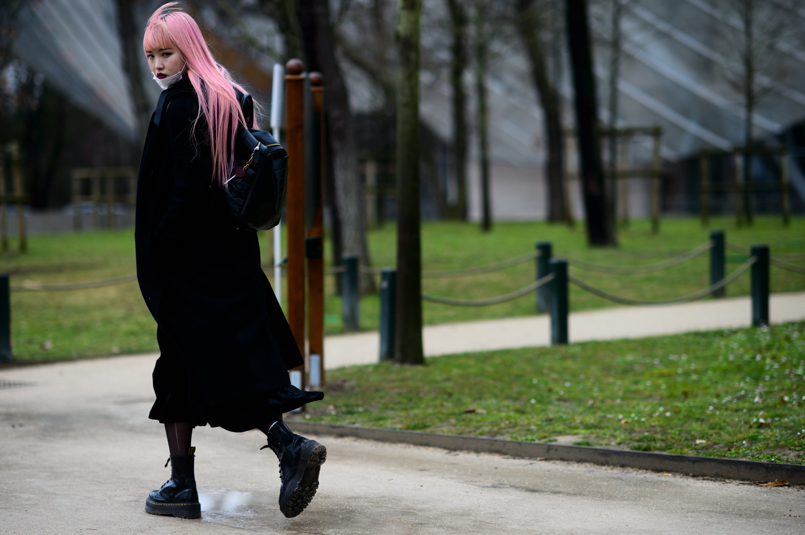 Model with pink hair in black military boots