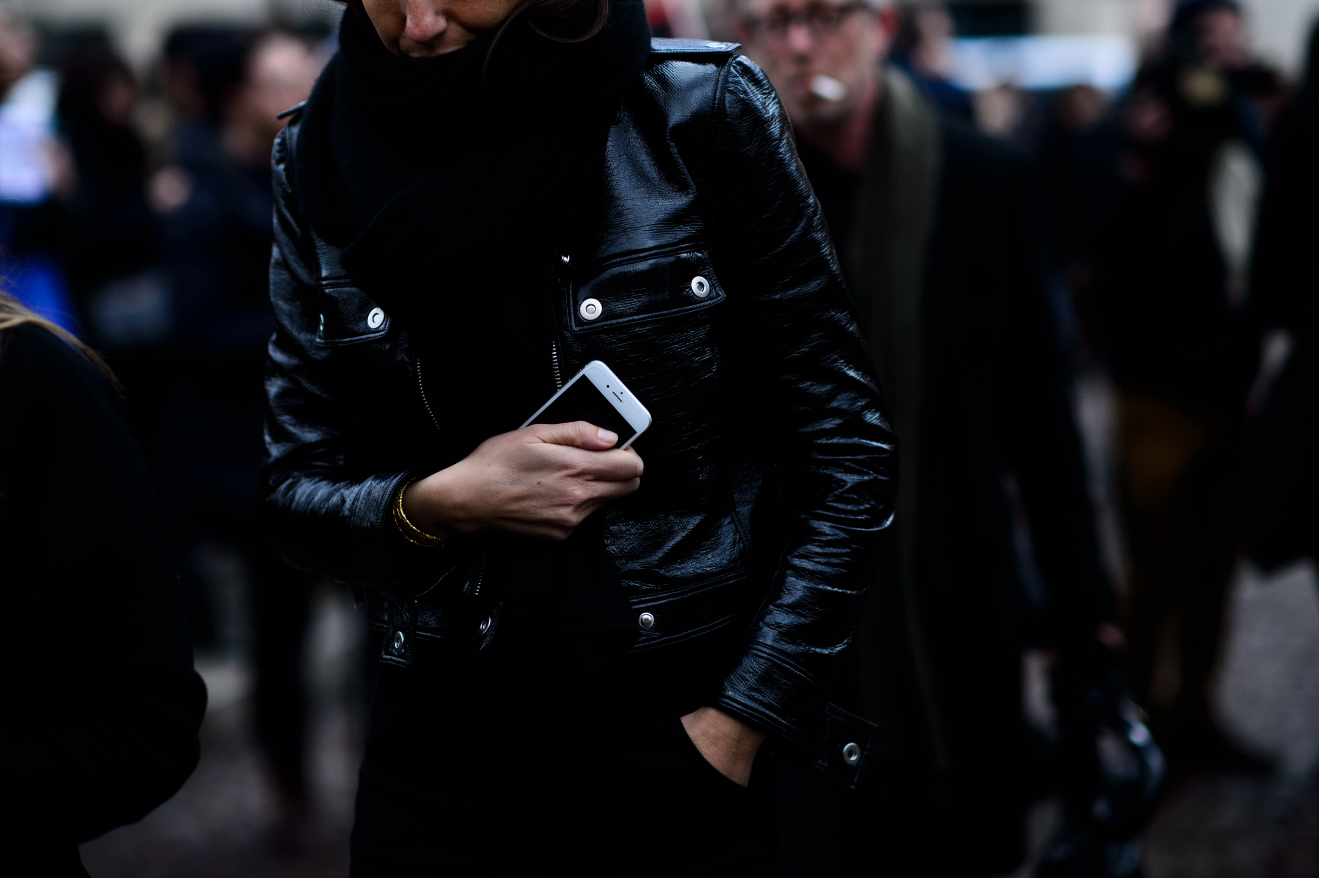Woman in black leather jacket and scarf