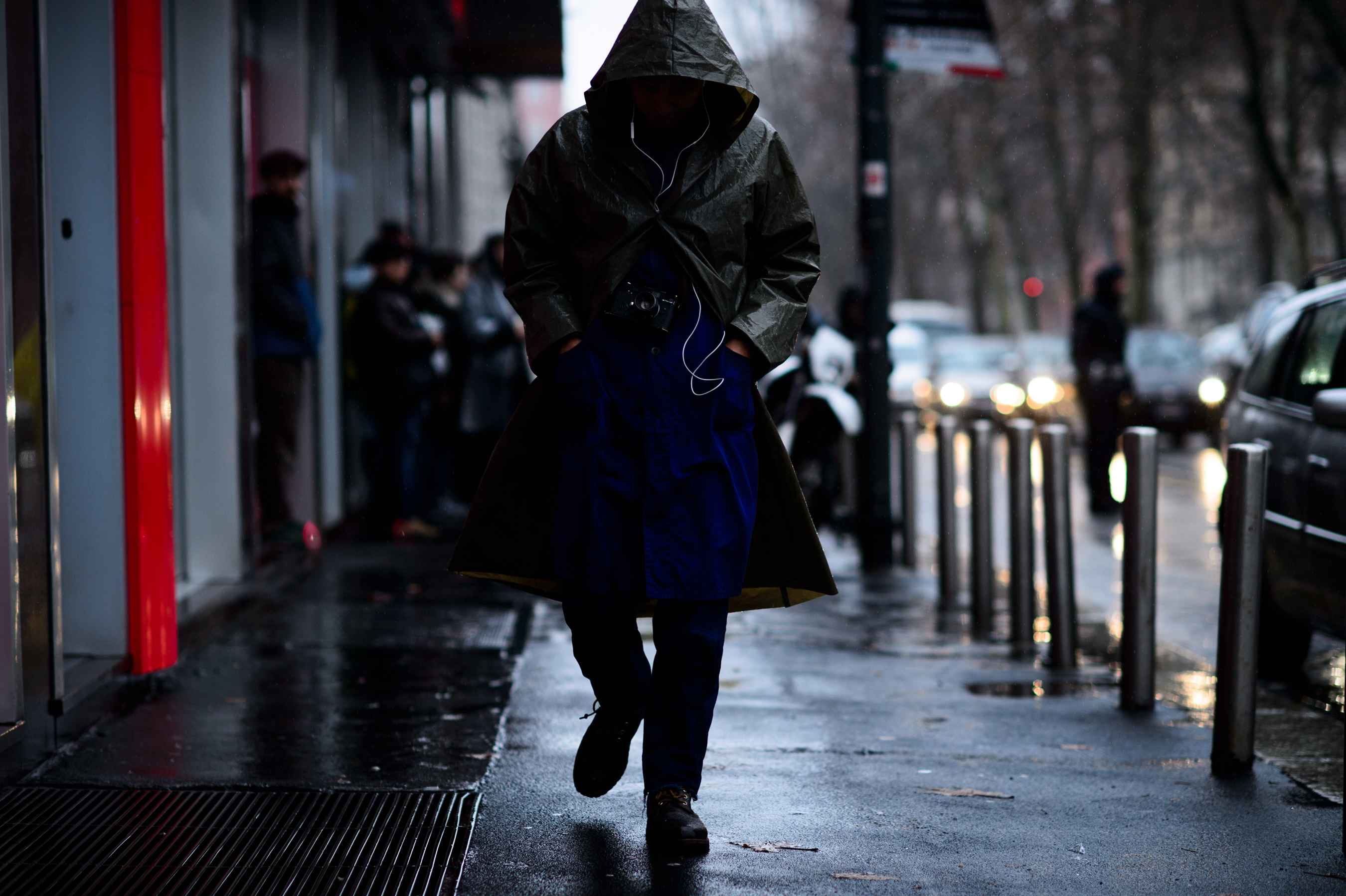 Korean photographer wearing rain coat