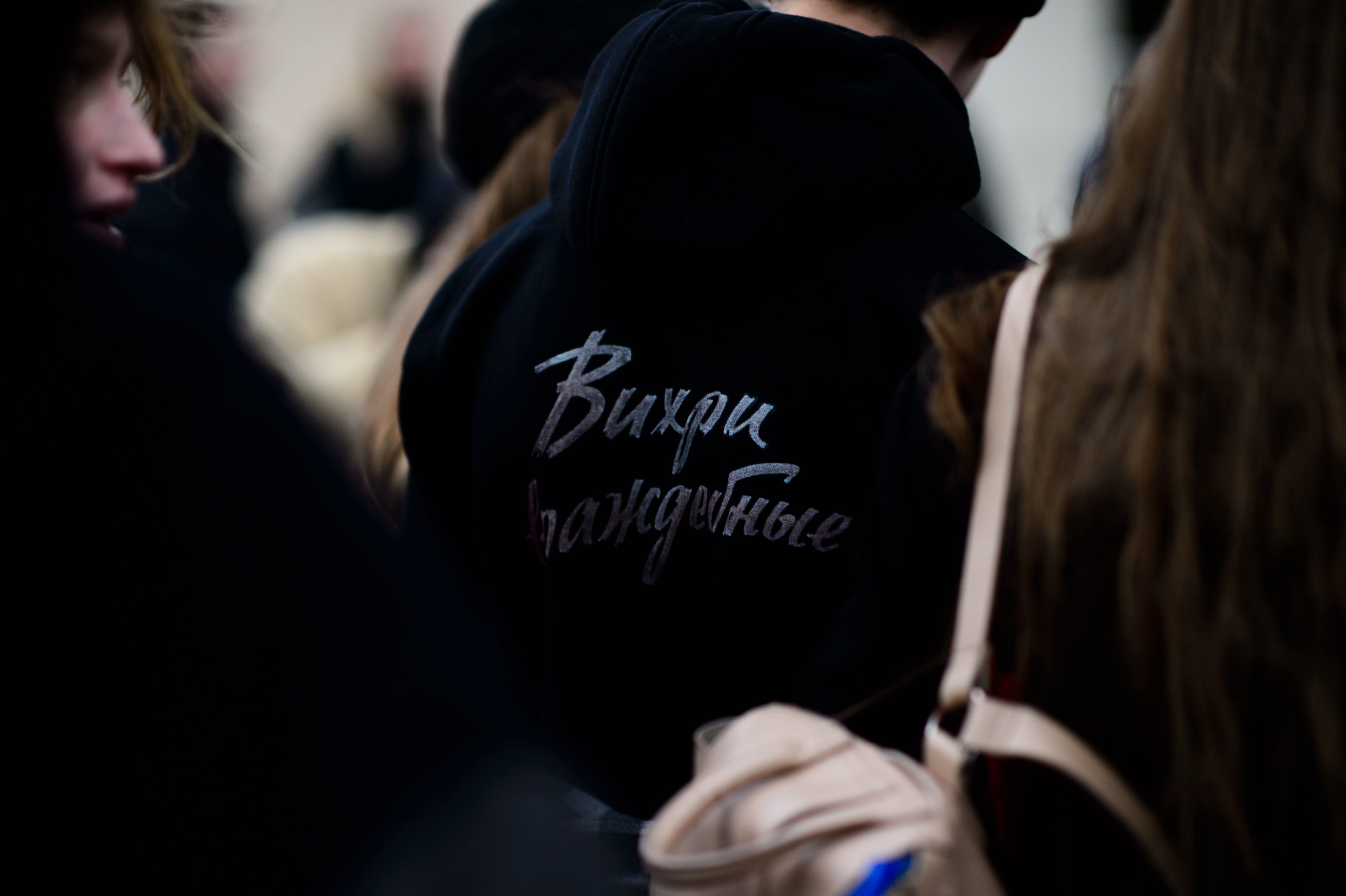 Closeup of man with back print hoodie