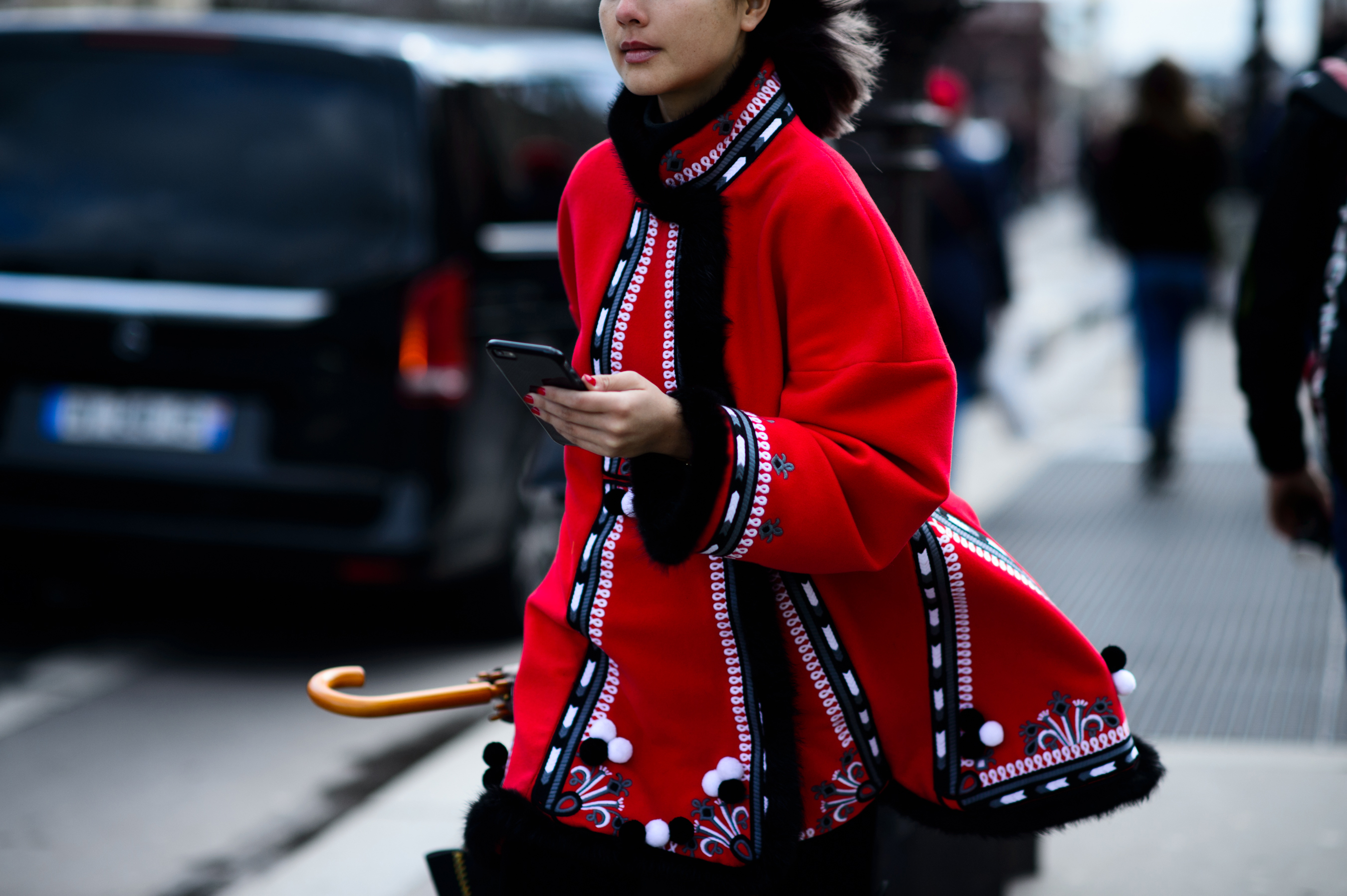 Woman in detailed red jacket