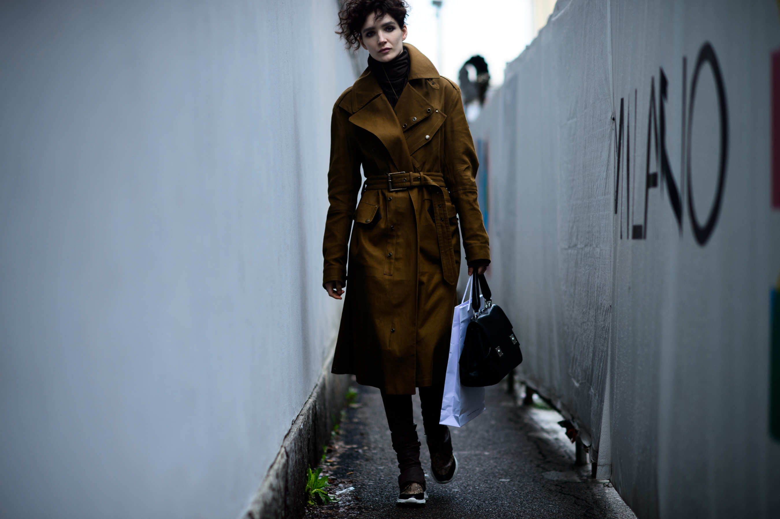 Model wearing brown coat after show
