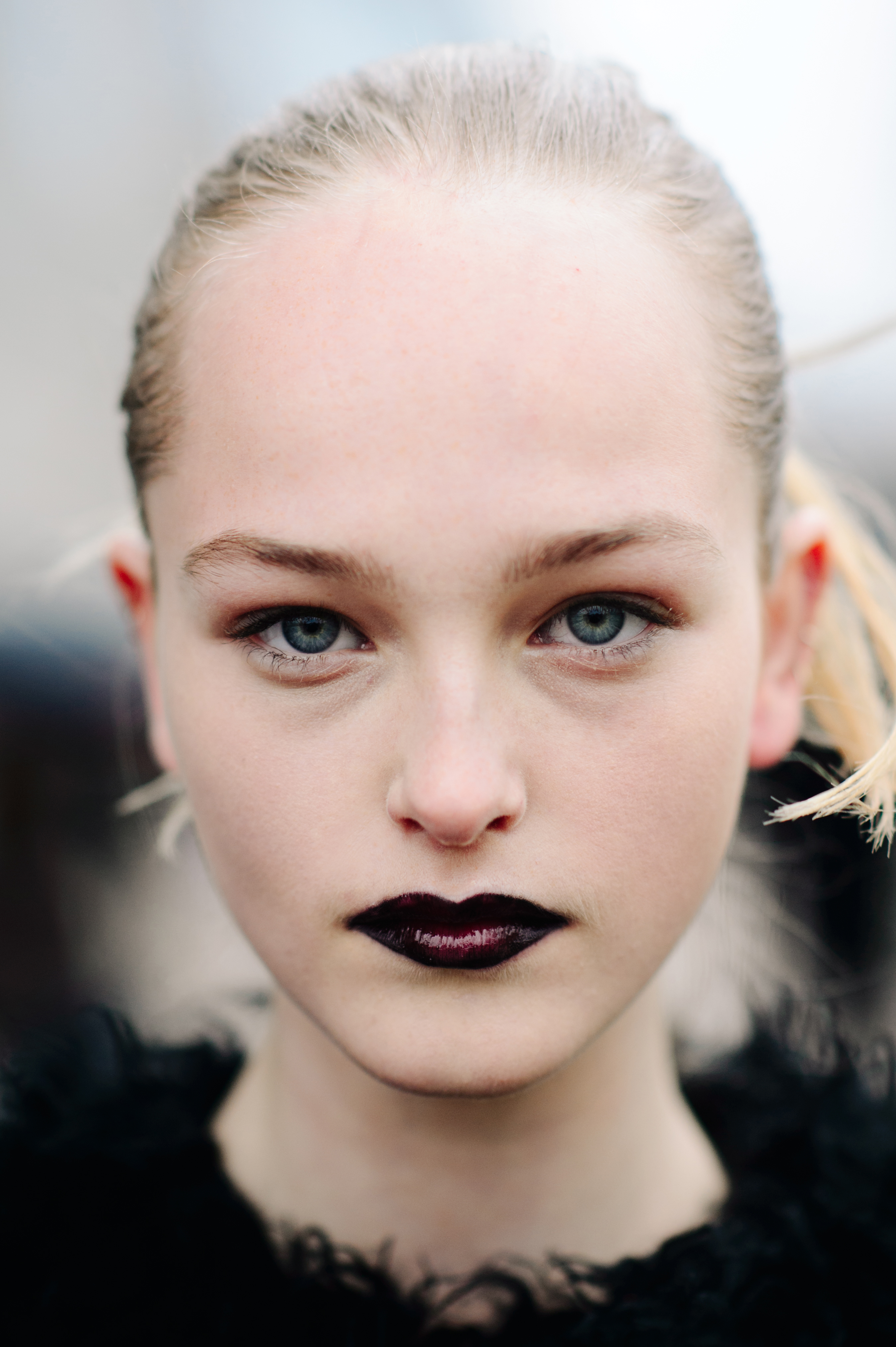 Portrait of model with dark lips and blue eyes
