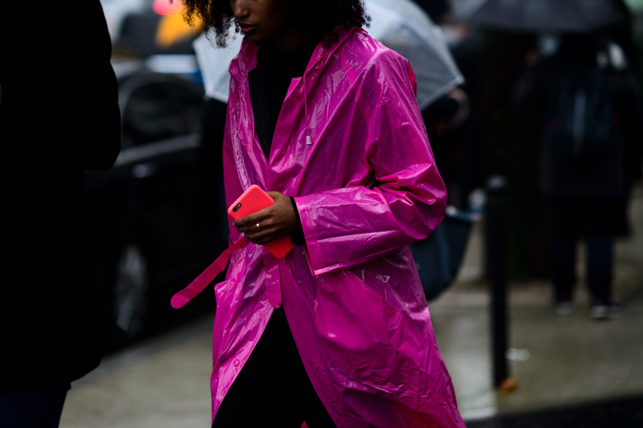 Woman in pink plastic raincoat