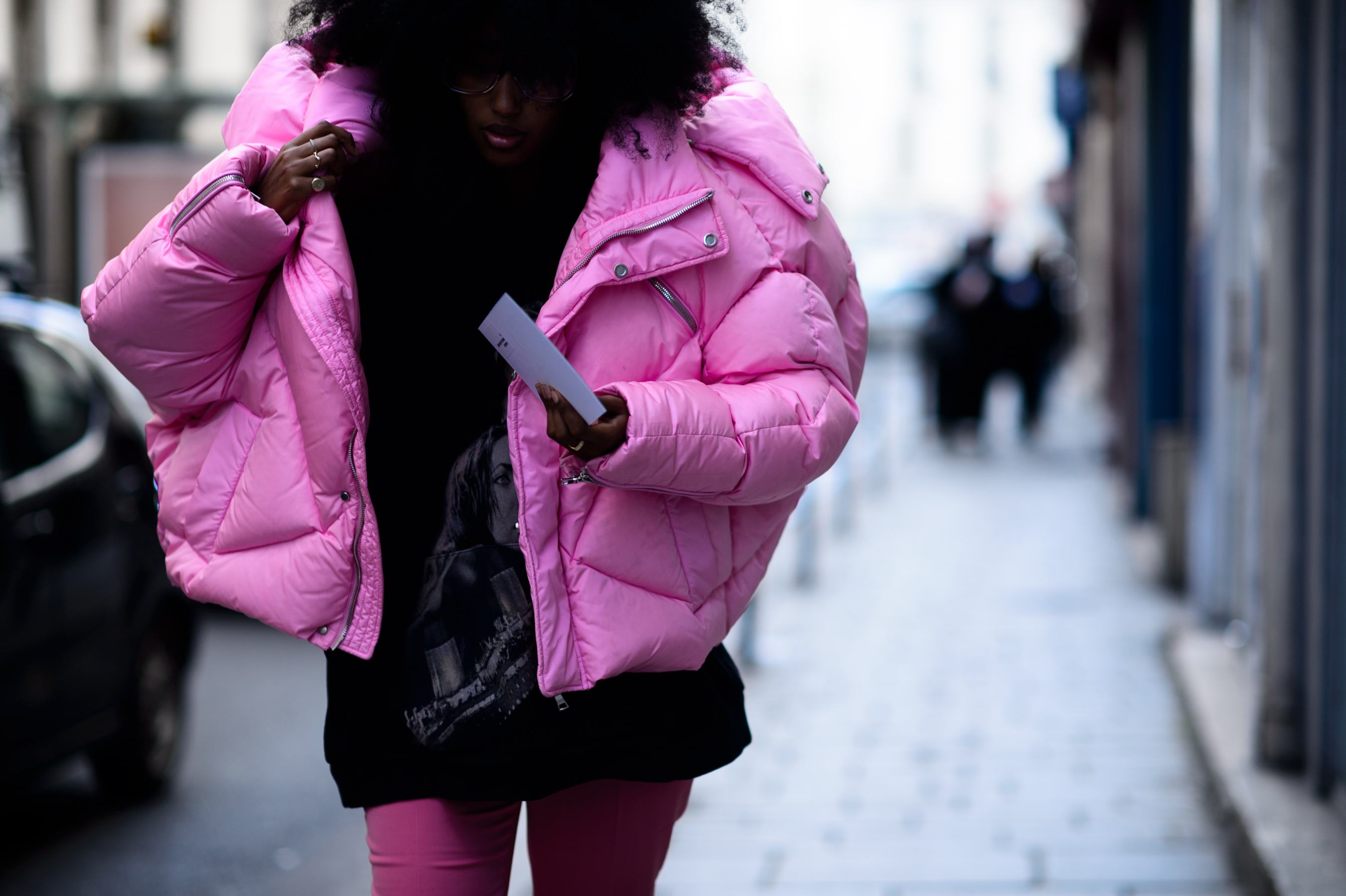 Woman wearing pink puffer coat