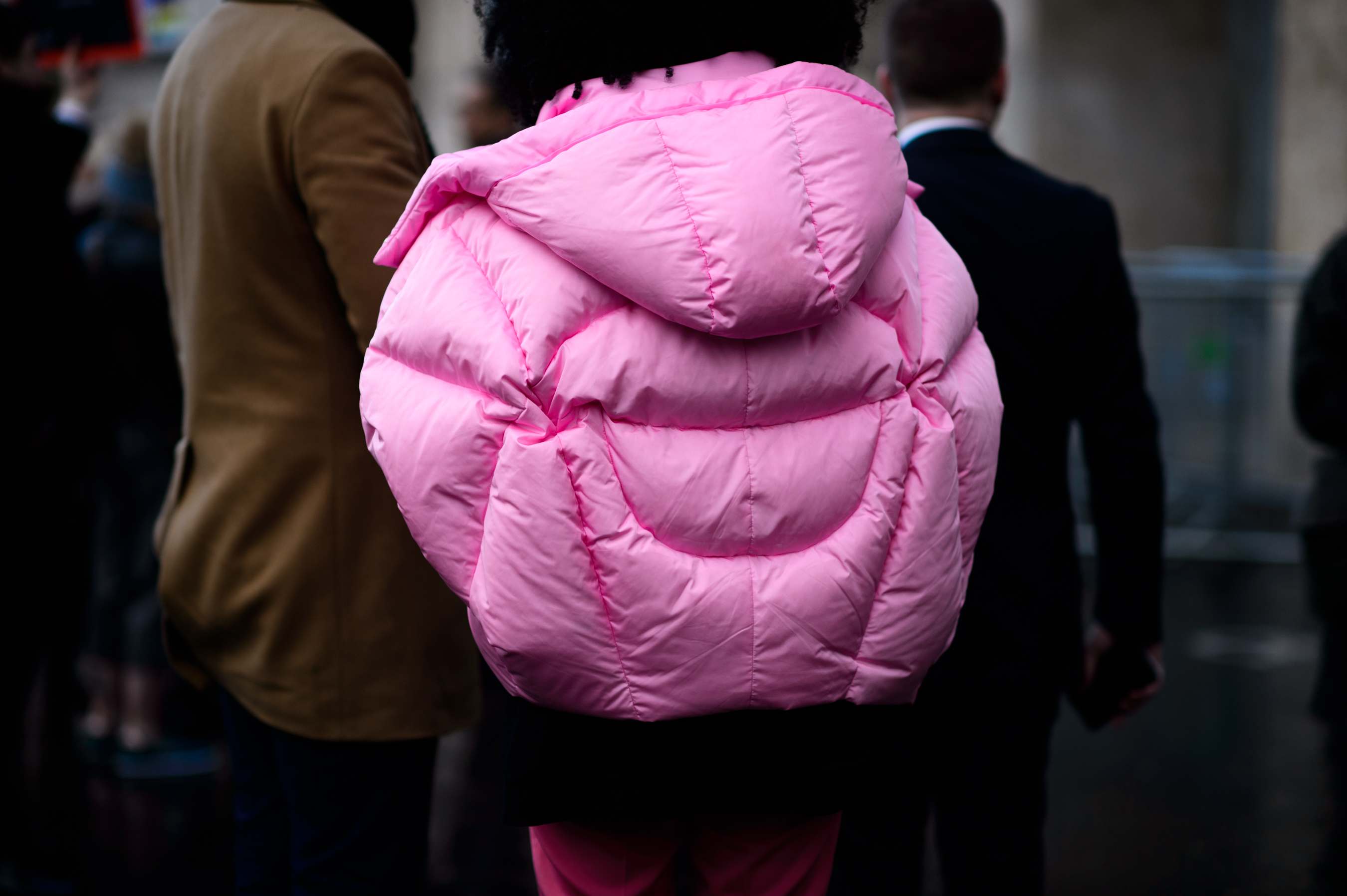 Woman wearing pink puffer coat