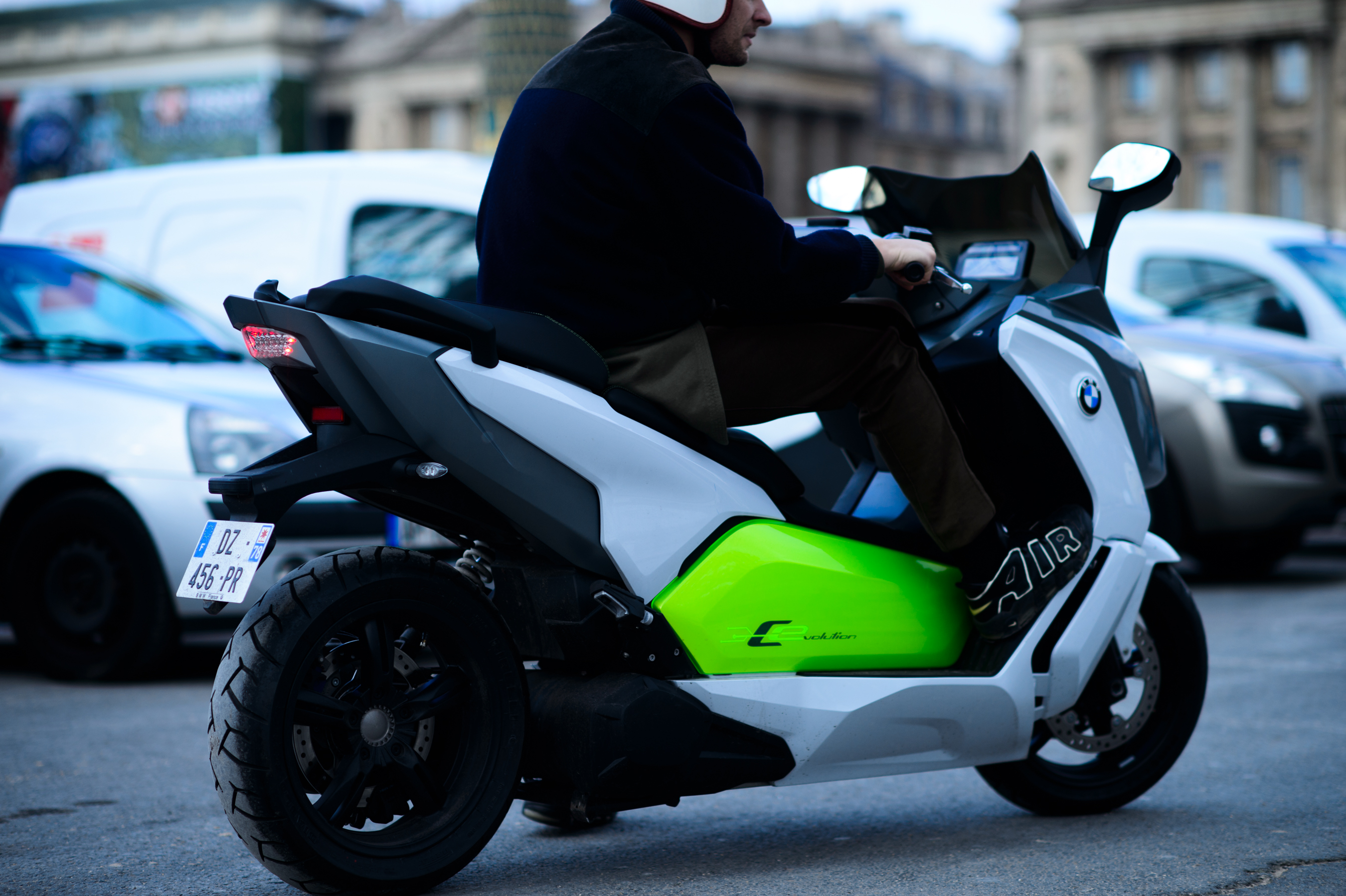 French photographer riding a scooter