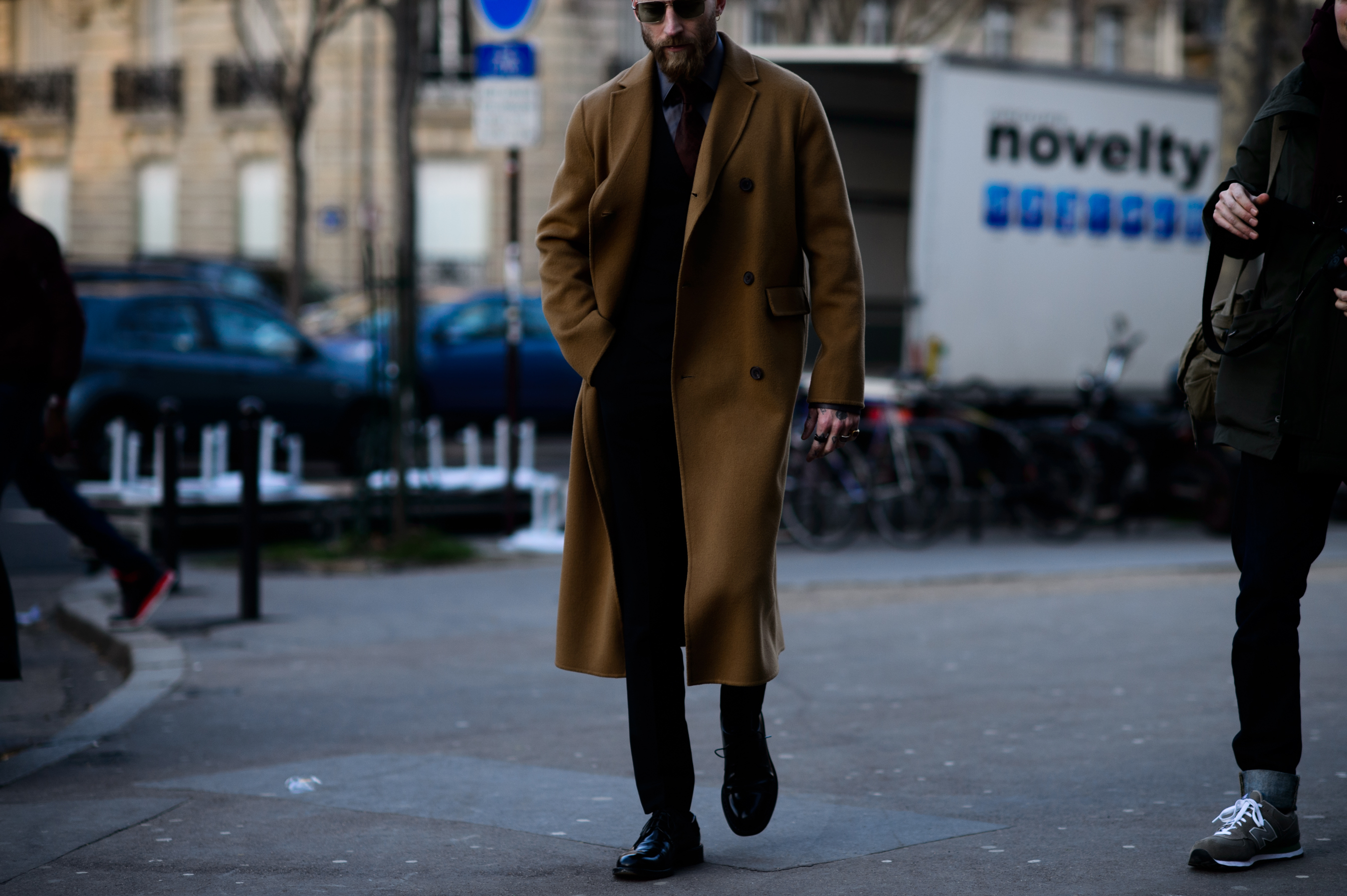 Buyer walks in camel trench coat