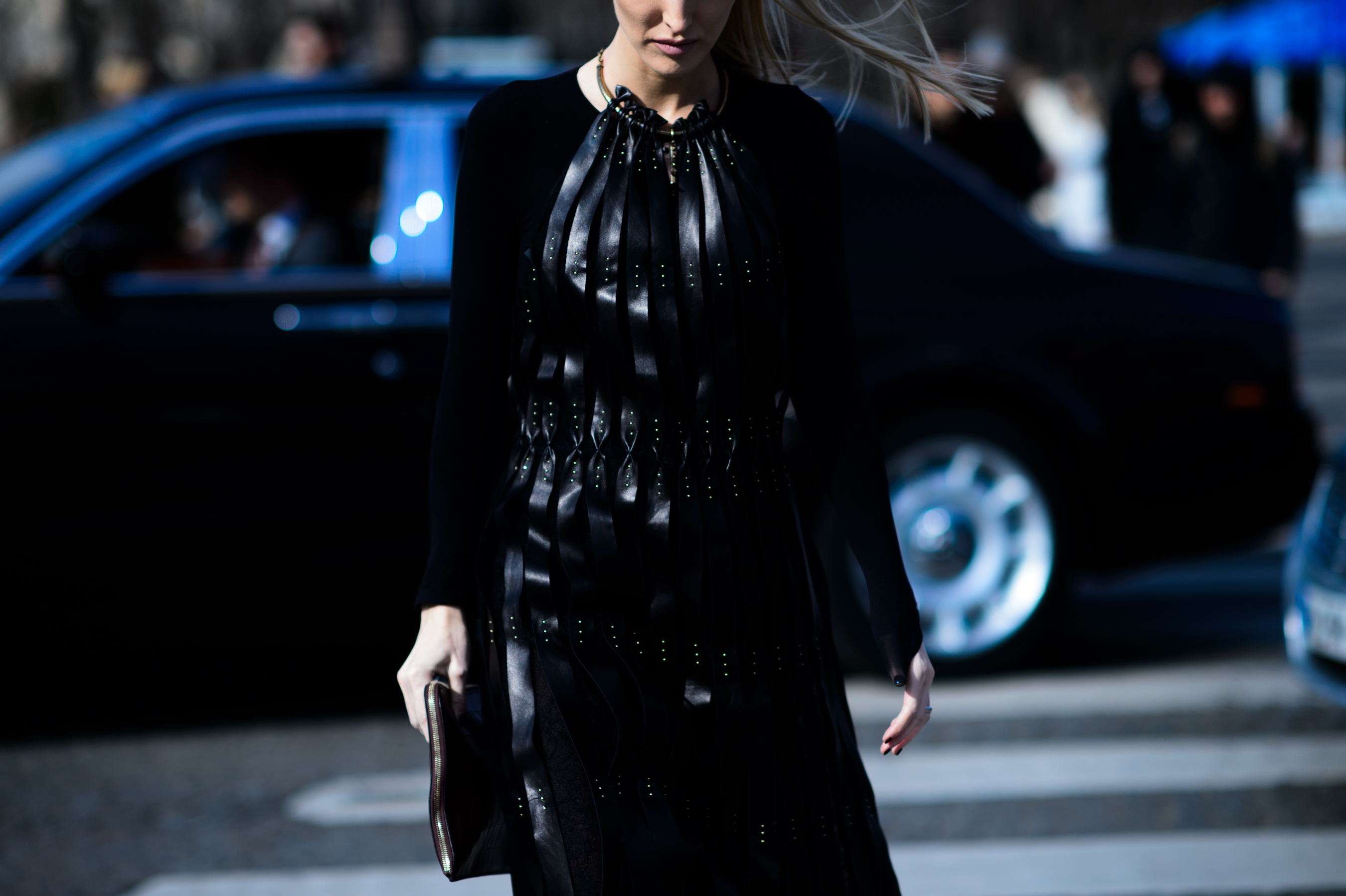 Woman wearing leather detail dress