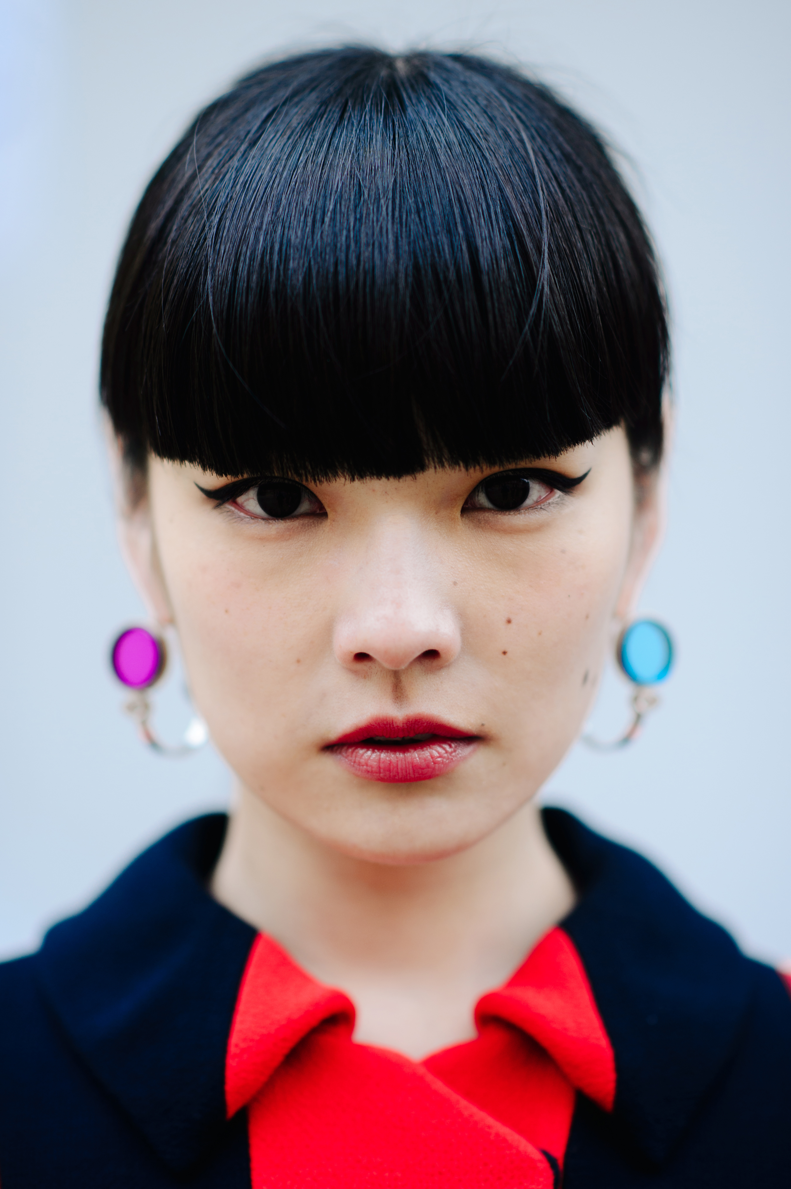 Portrait of Japanese model with colourful earrings