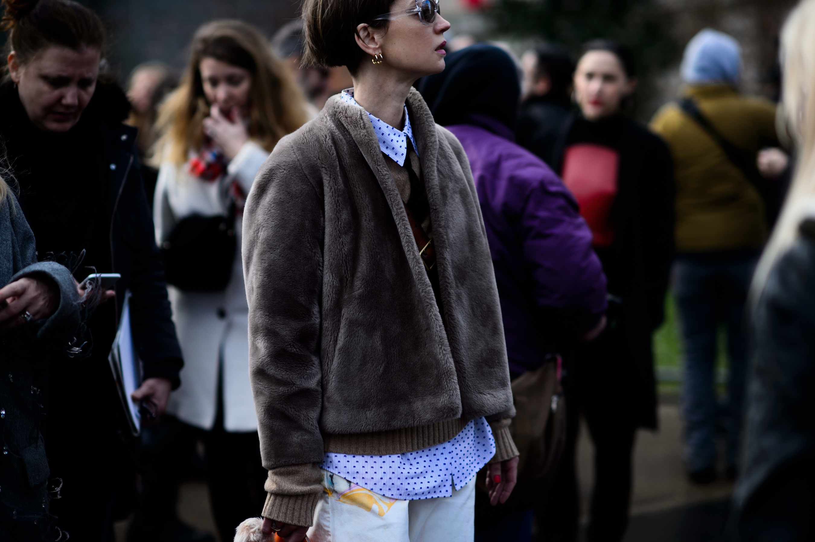 Woman wearing grey fur jacket