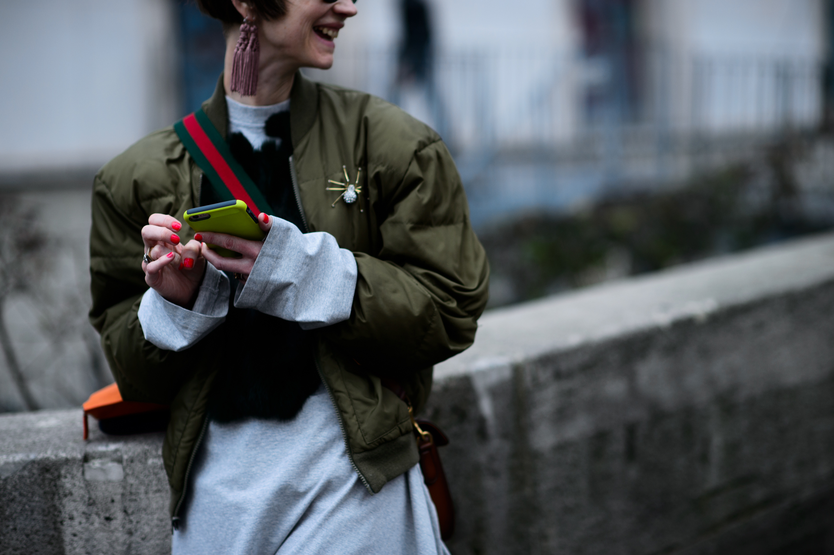 Woman wearing green bomber jacket