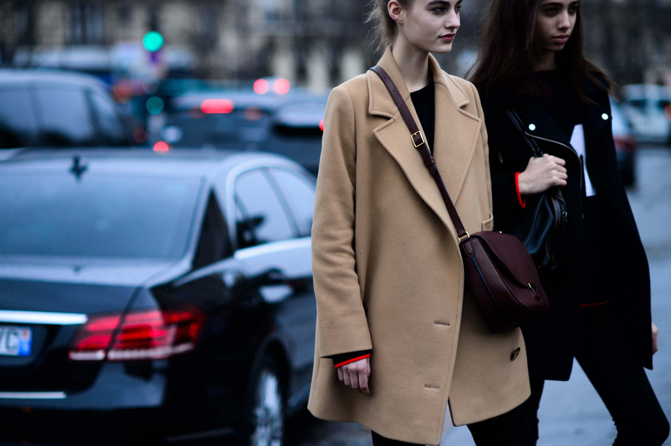 Two models walking off camera