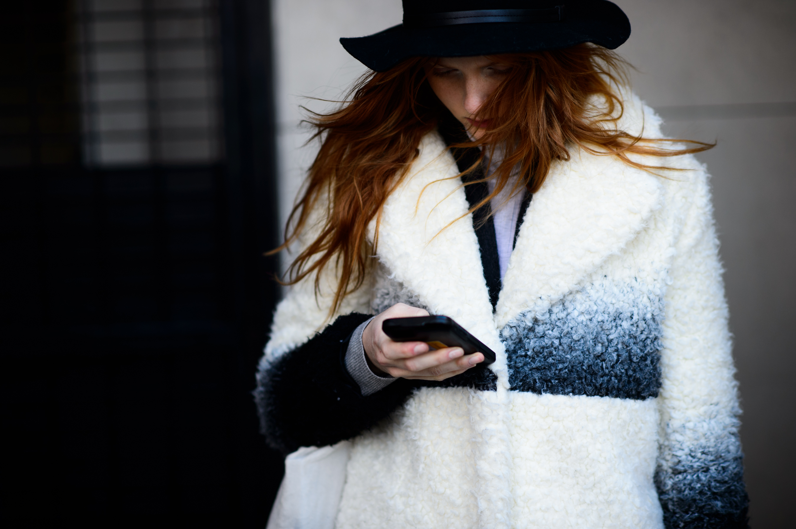 Australian model wearing white coat