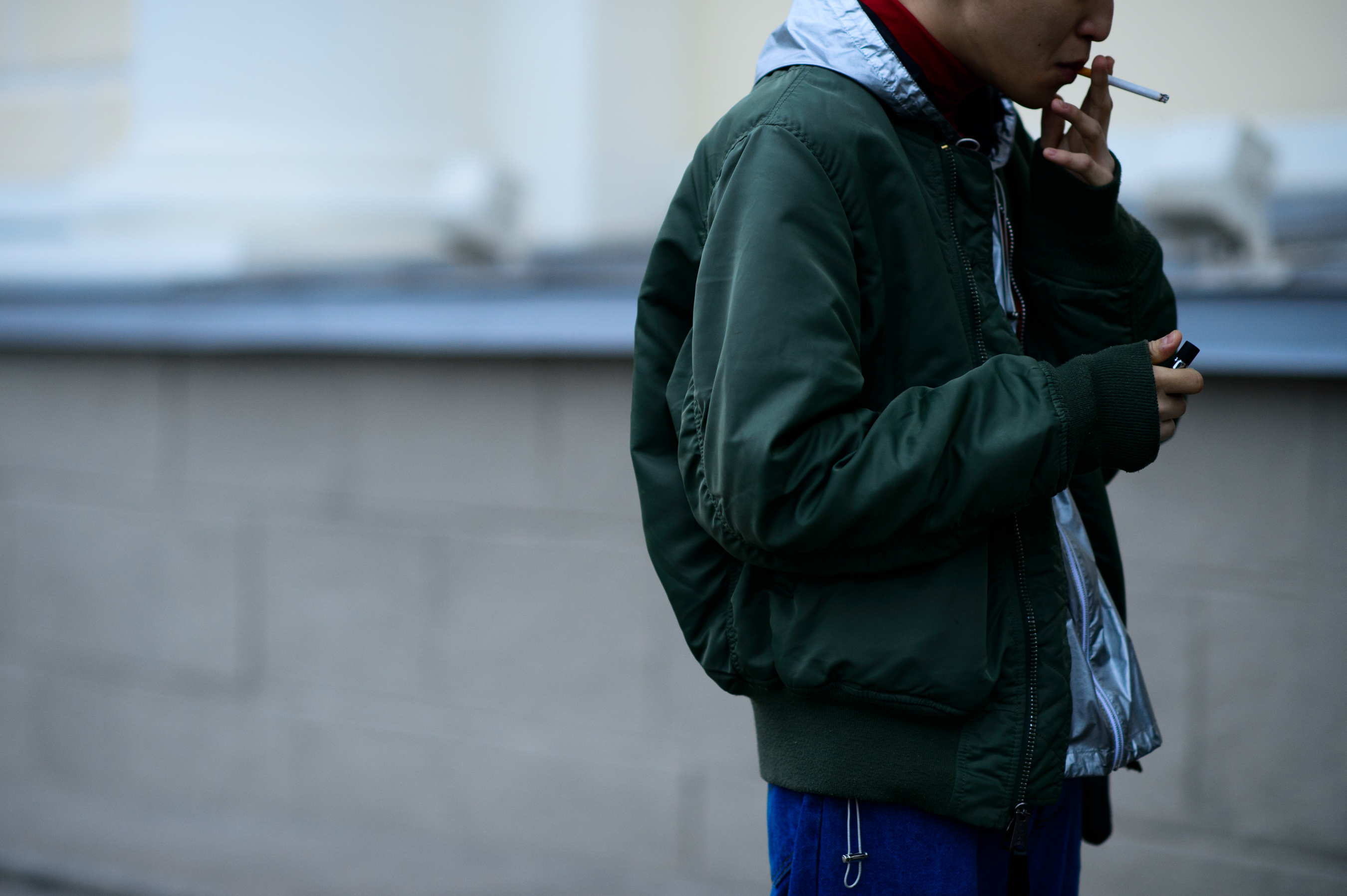 Man wearing green bomber jacket
