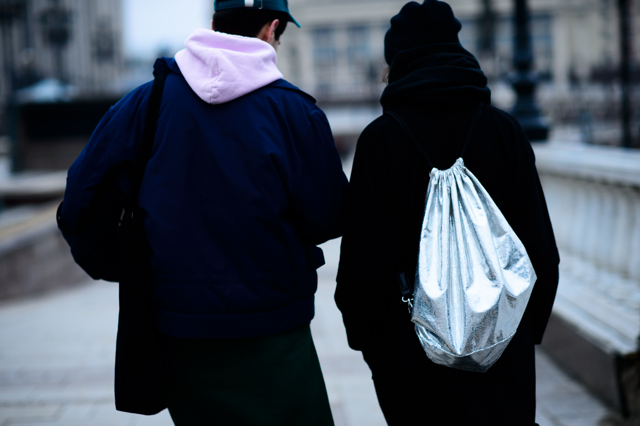 Boy and girl attending fashion week