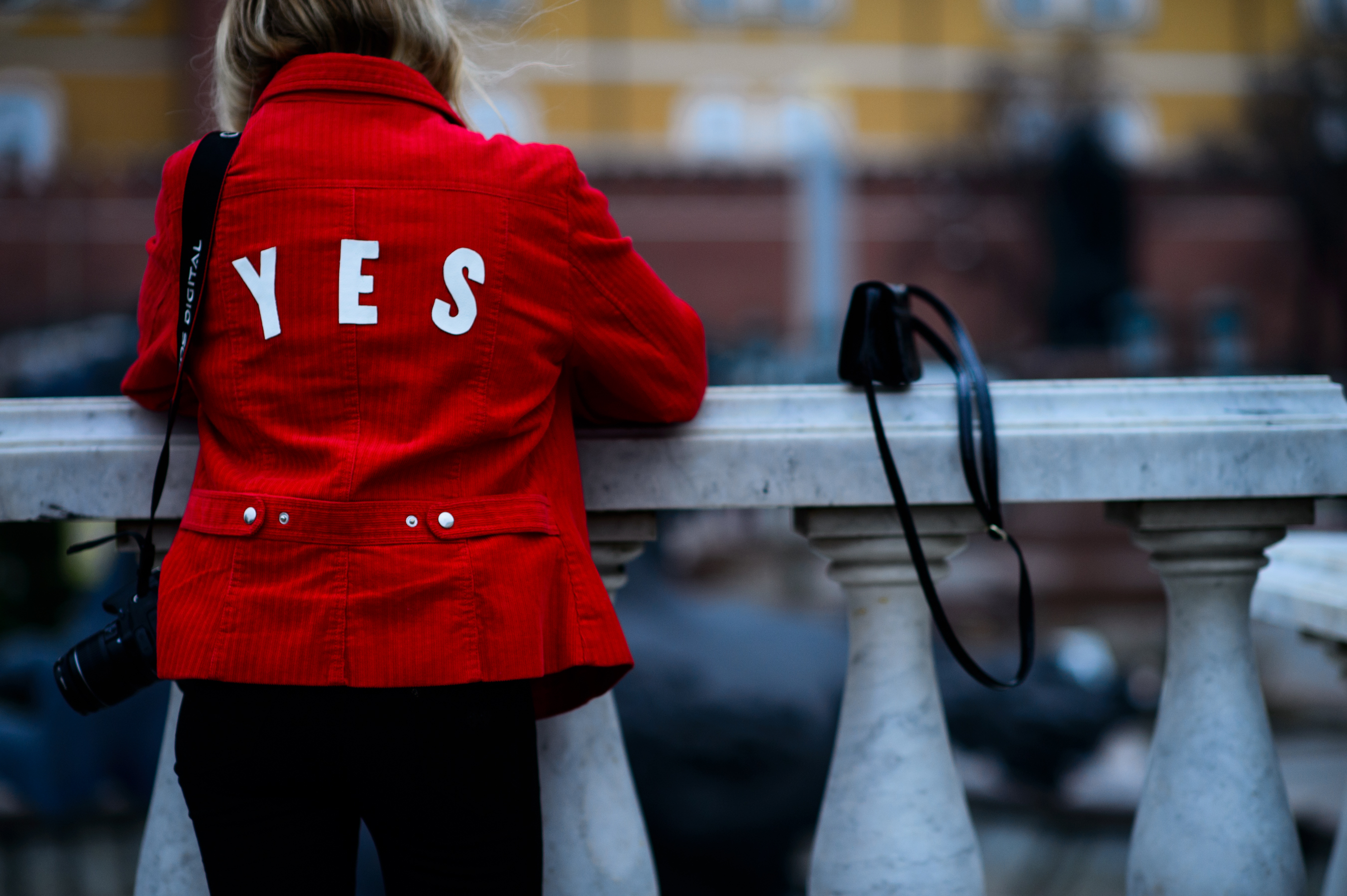 Girl wearing red YES jacket