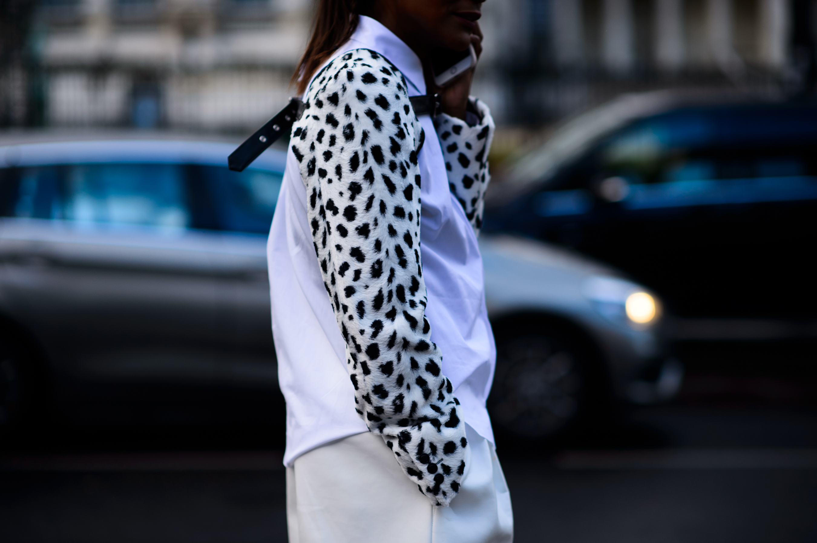 Woman on phone wearing white