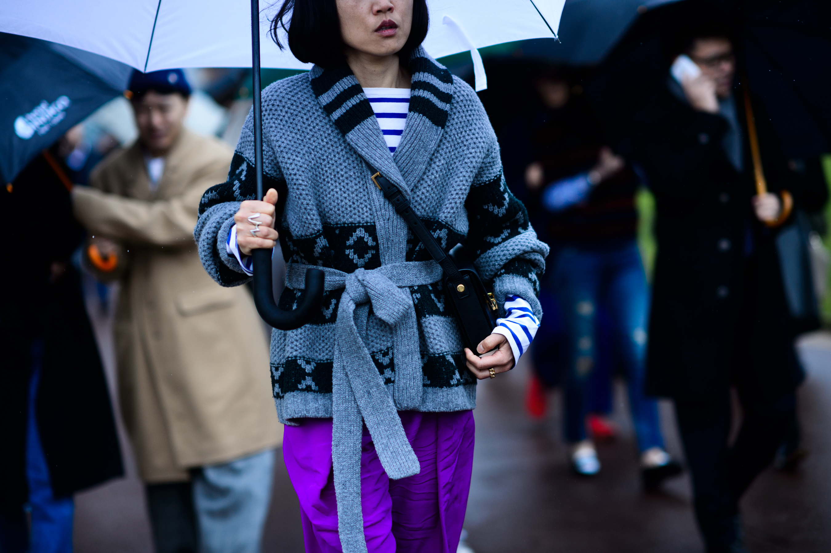 Woman wearing grey knit jacket