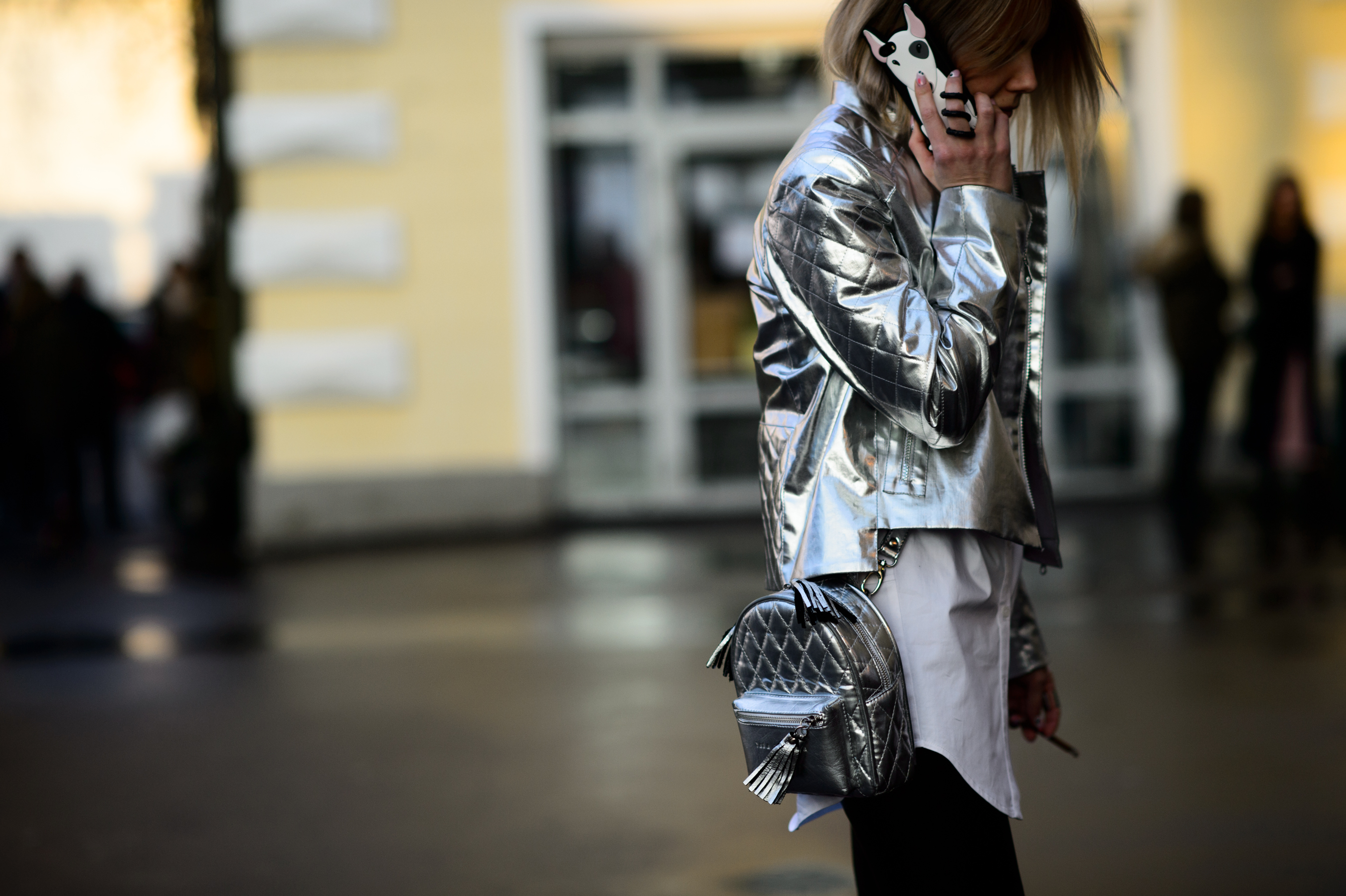 Girl wearing silver bag and jacket