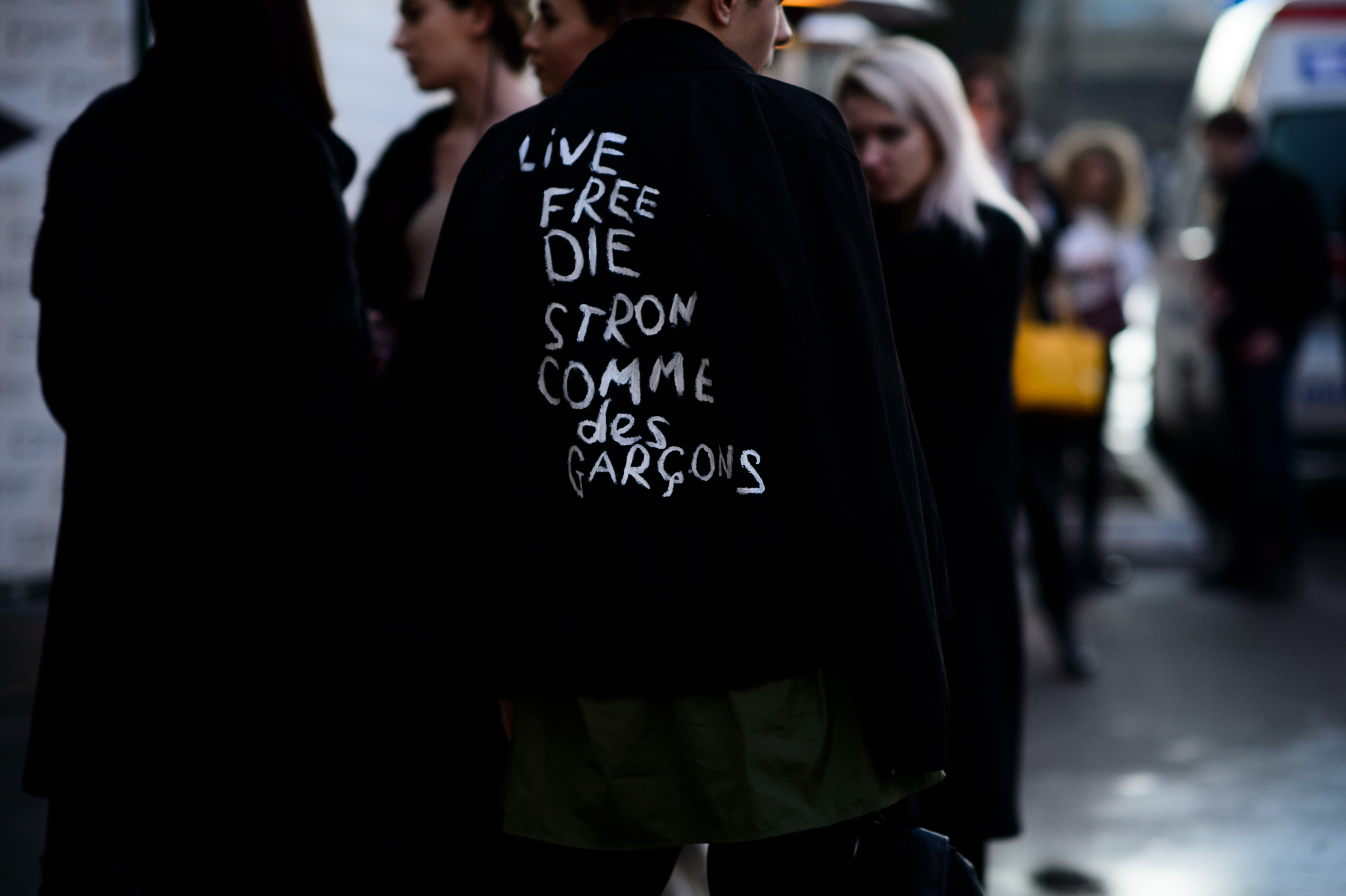 Man wearing jacket with letters