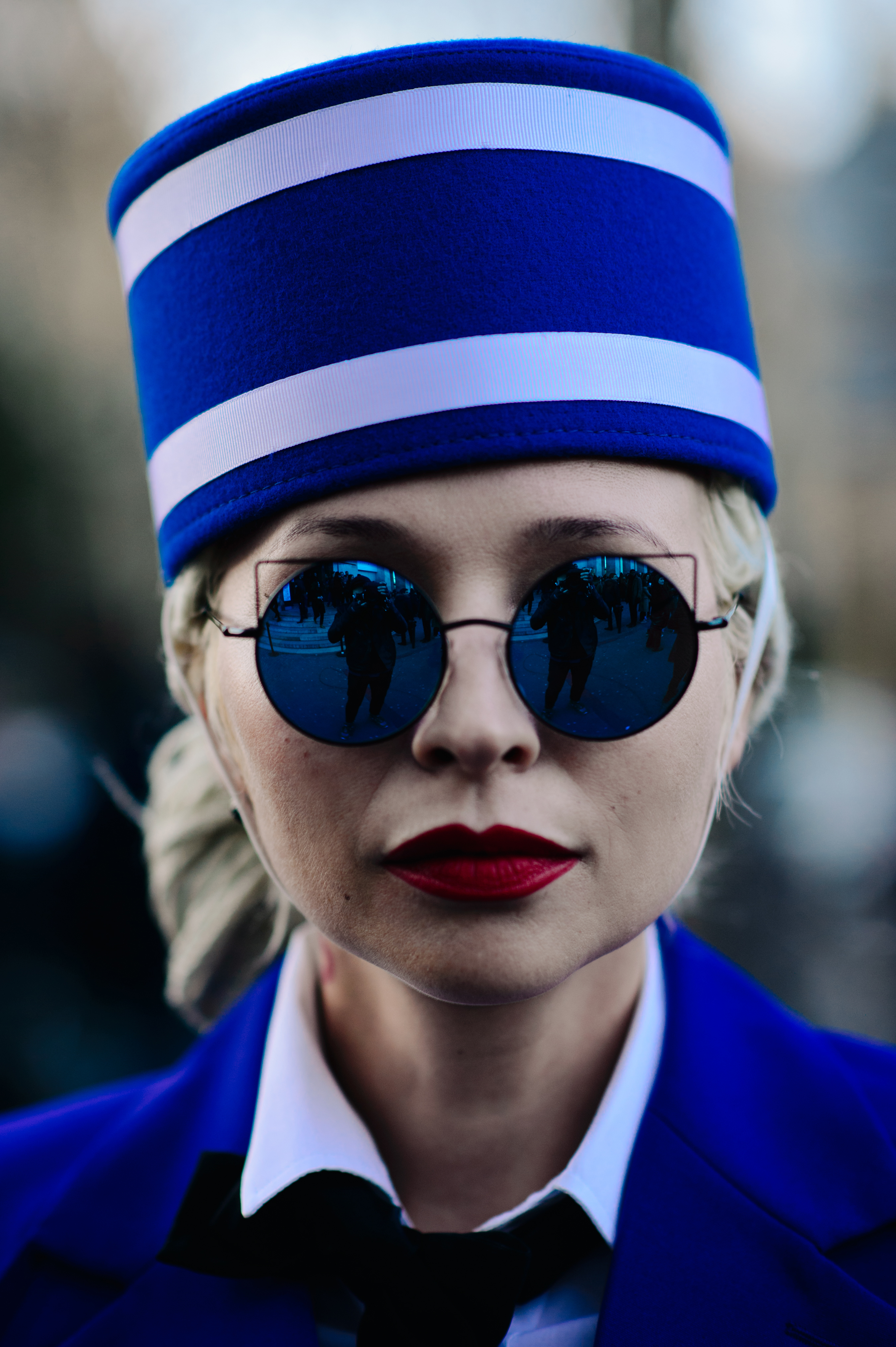 Portrait of woman with blue hat and glasses