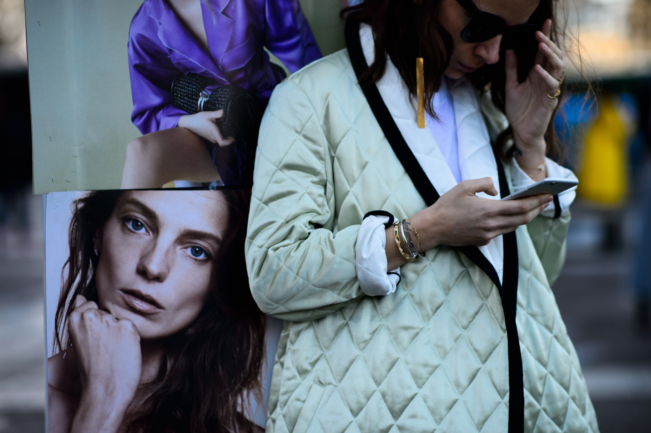 Russian buyer wearing quilted jacket and sunglasses