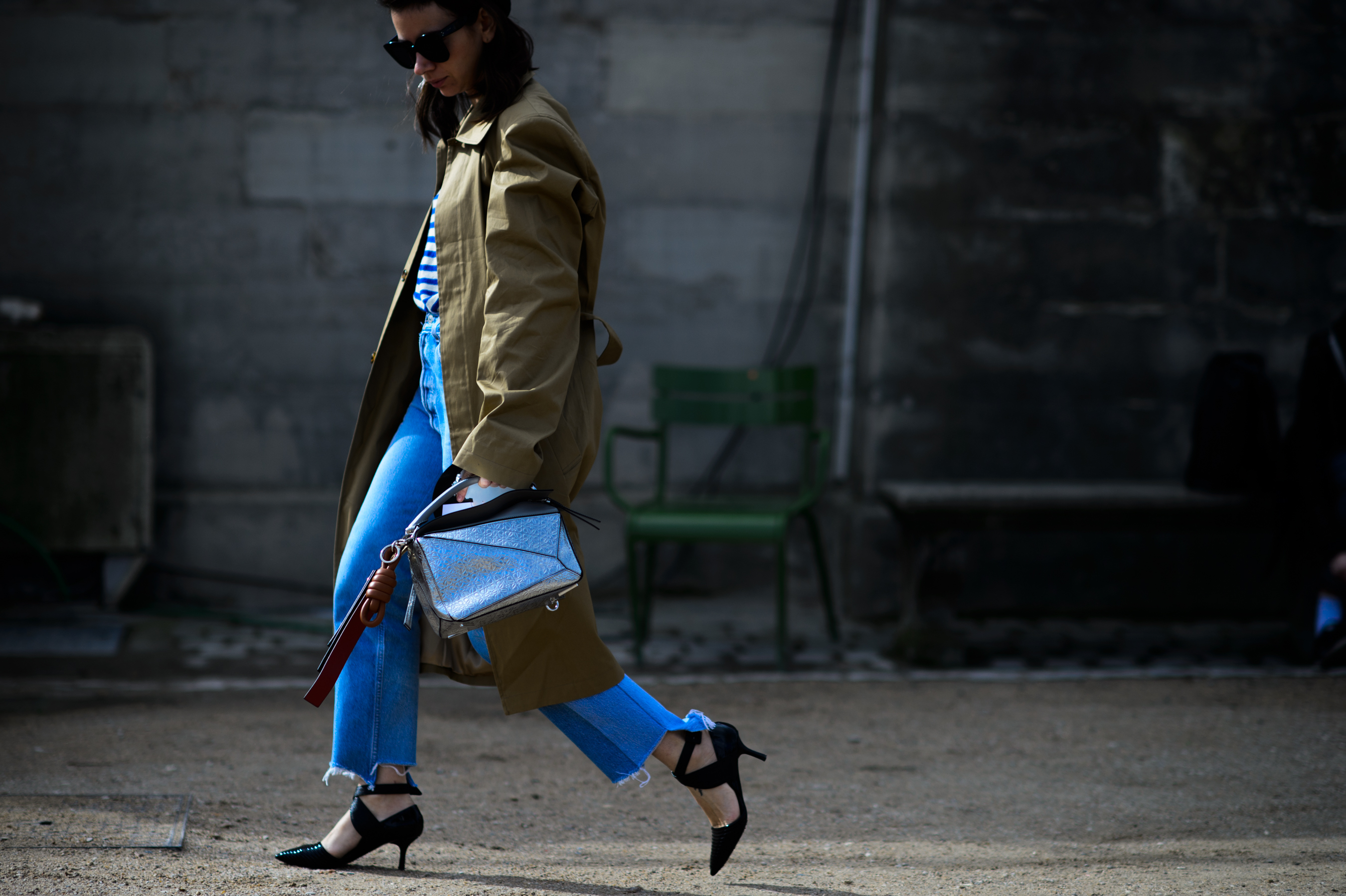 Russian buyer walking with silver bag