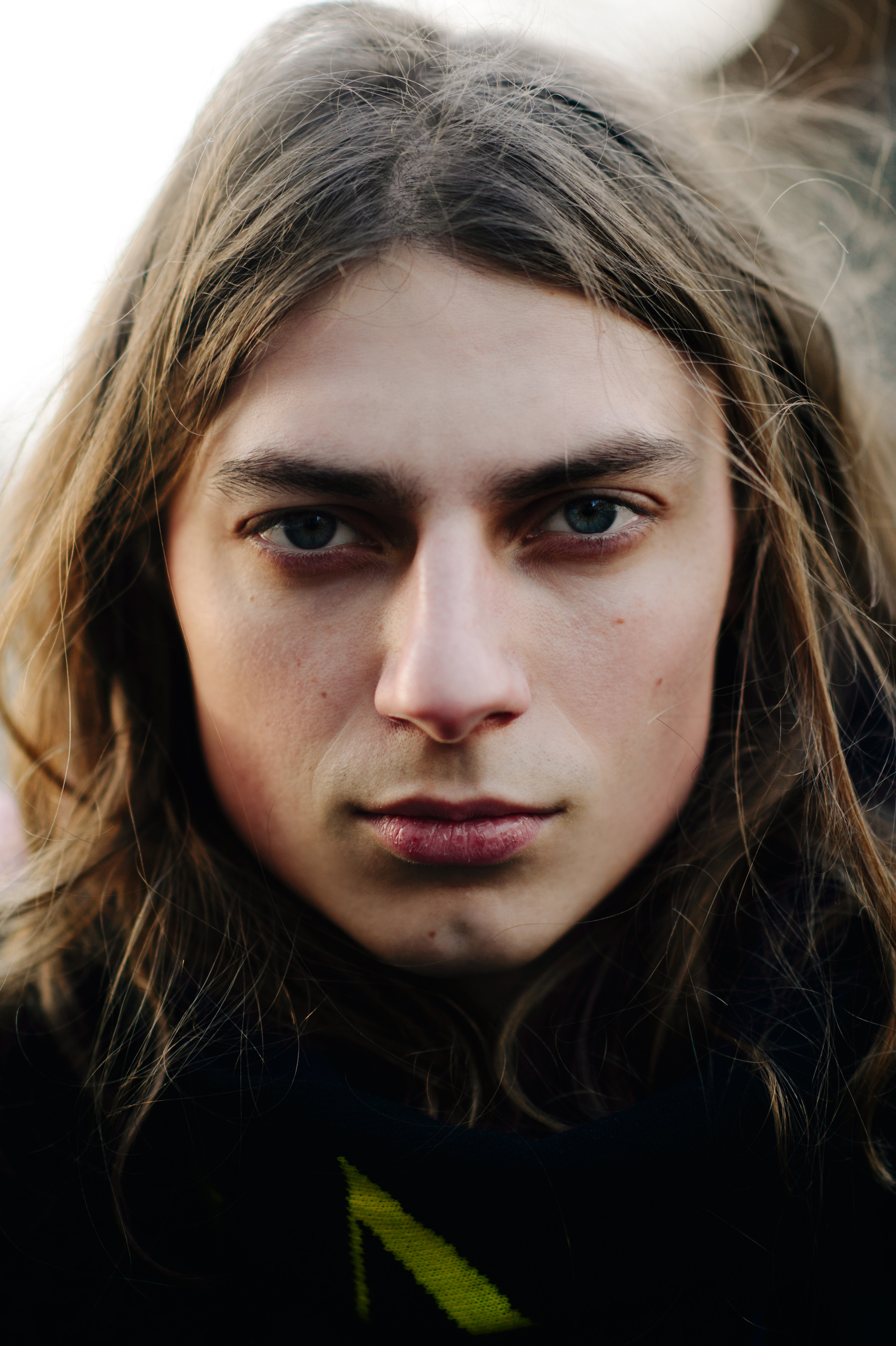 Portrait of a Ukrainian guy long hair