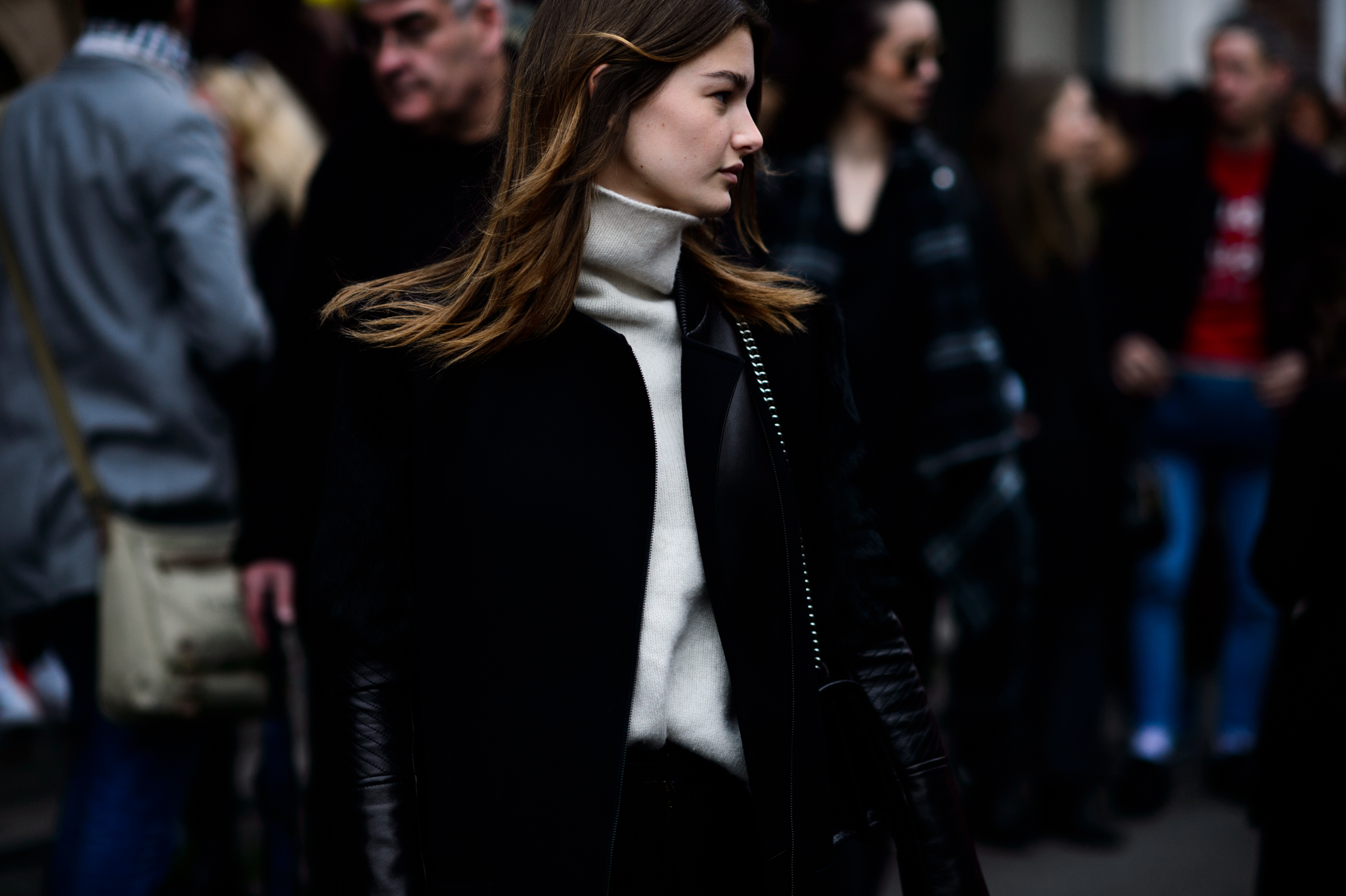 French model wearing cream turtleneck
