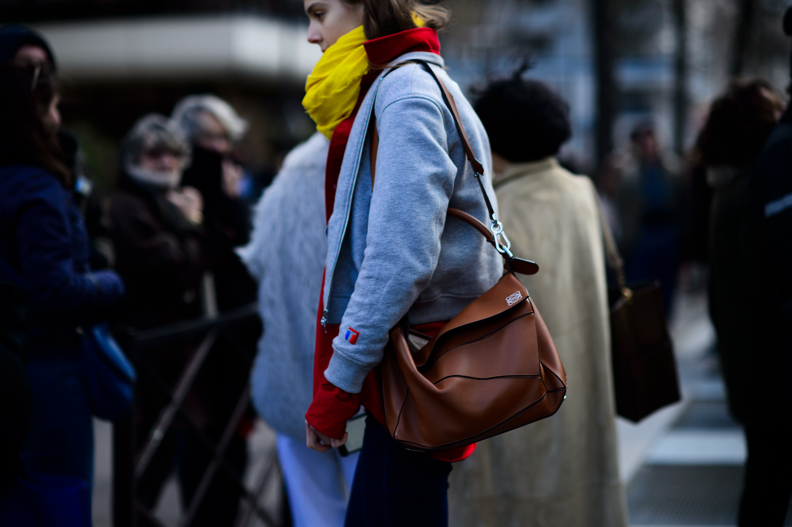 Model wearing large red and yellow scarf