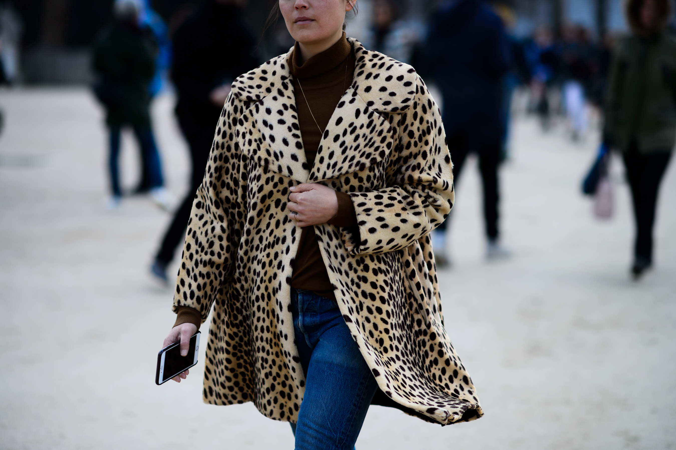 Woman wearing spotted jacket