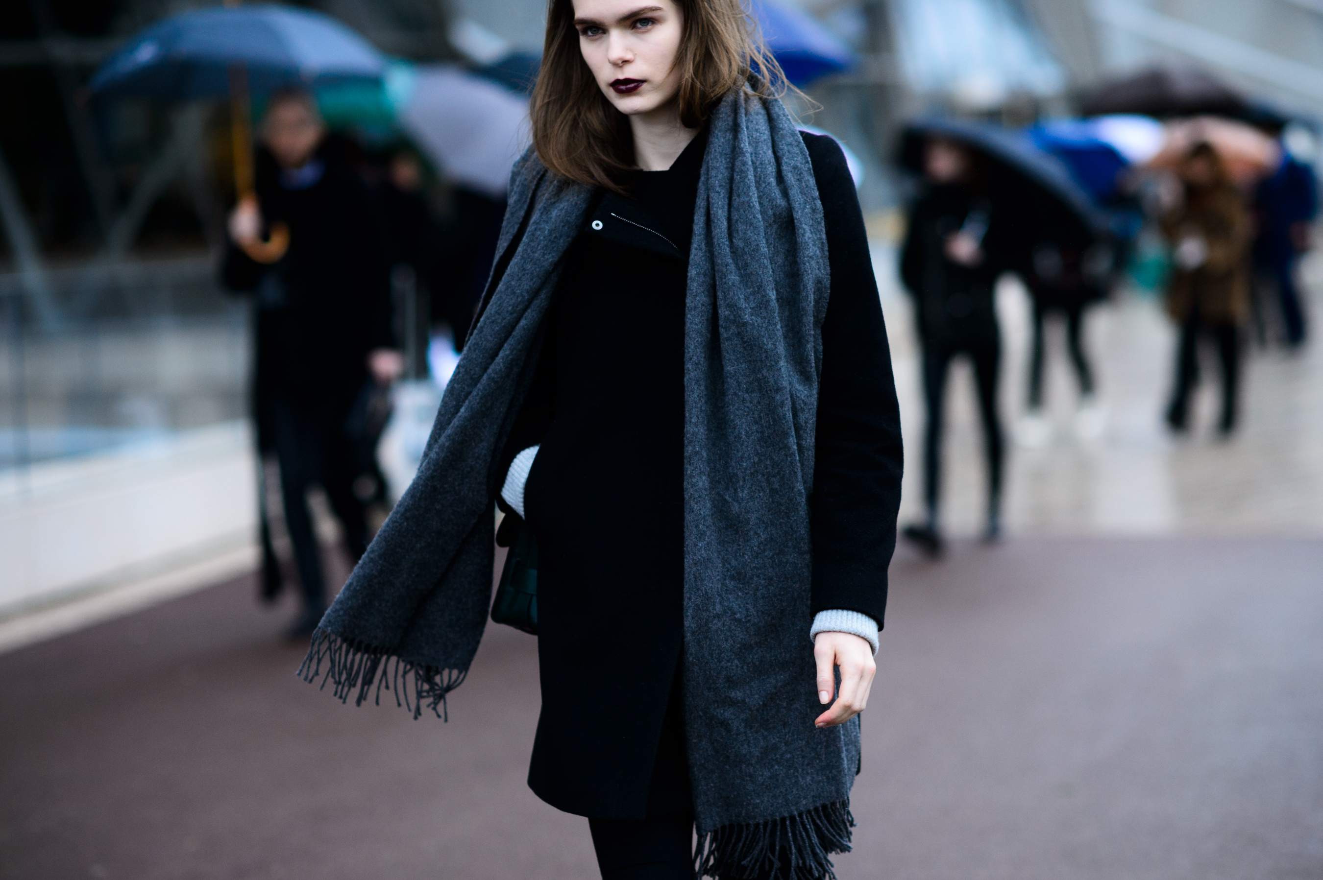 Model with dark lipstick and grey scarf