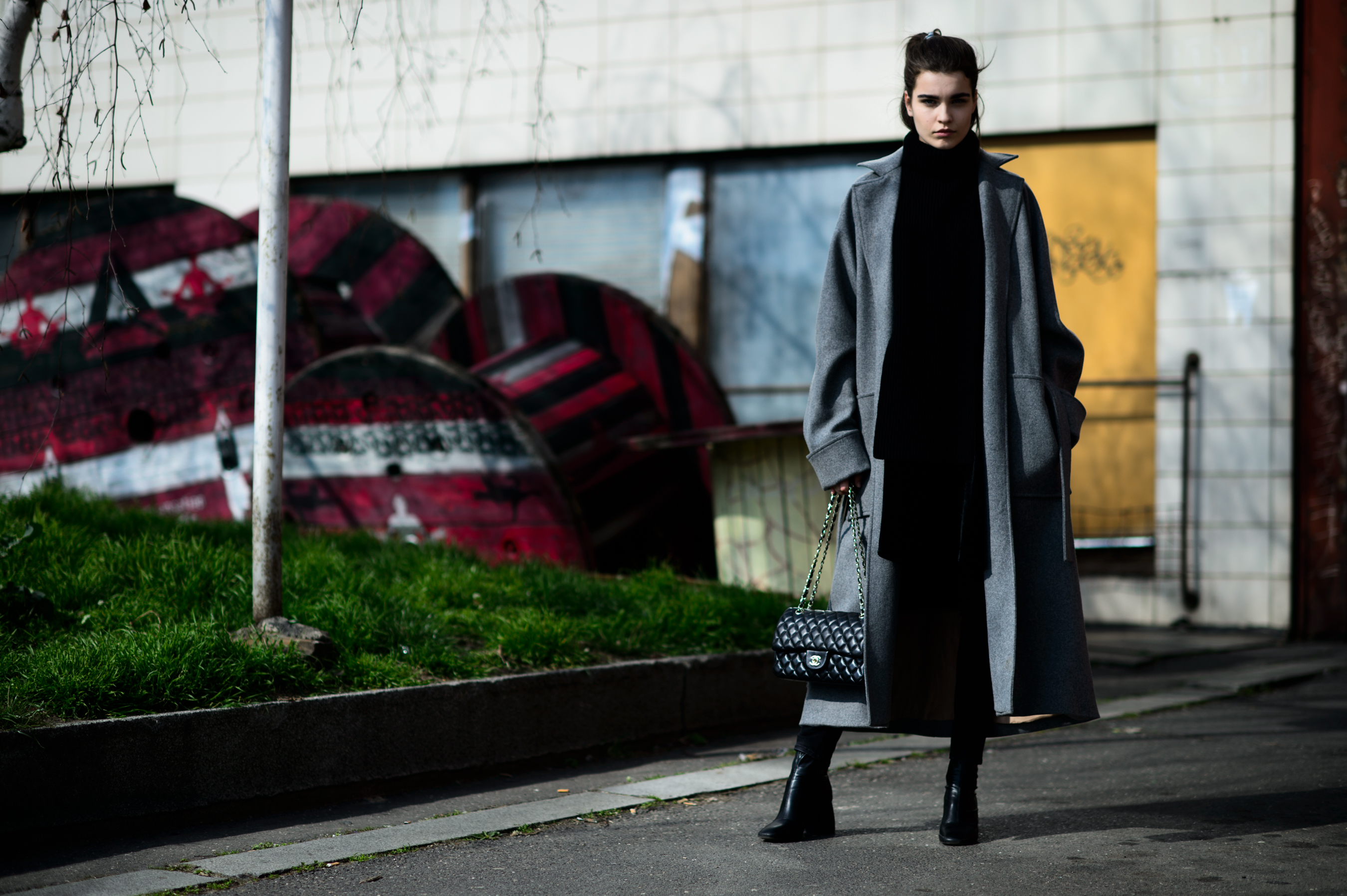 Model wearing long grey coat