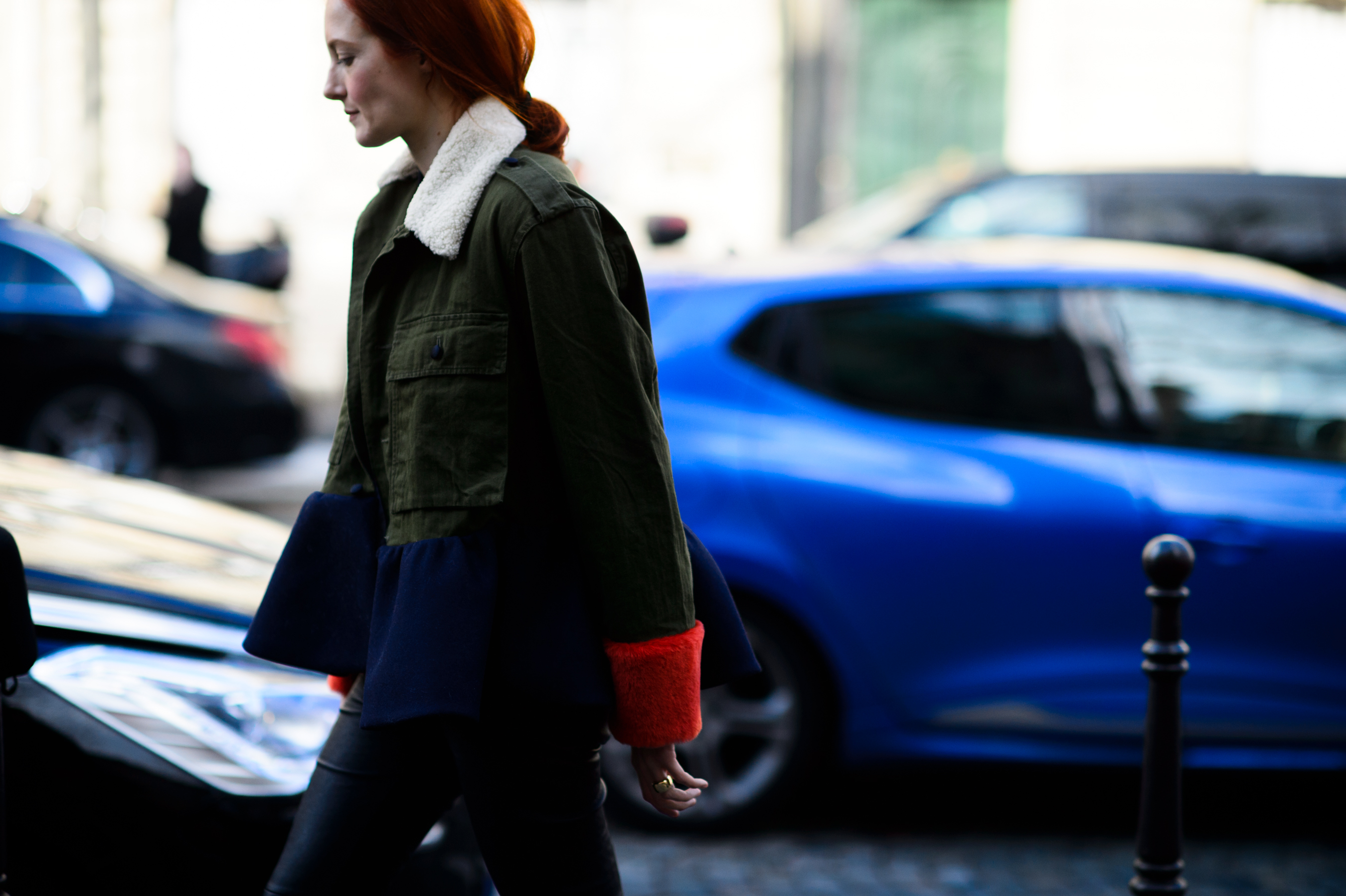 Woman wearing green denim jacket with shearling collar