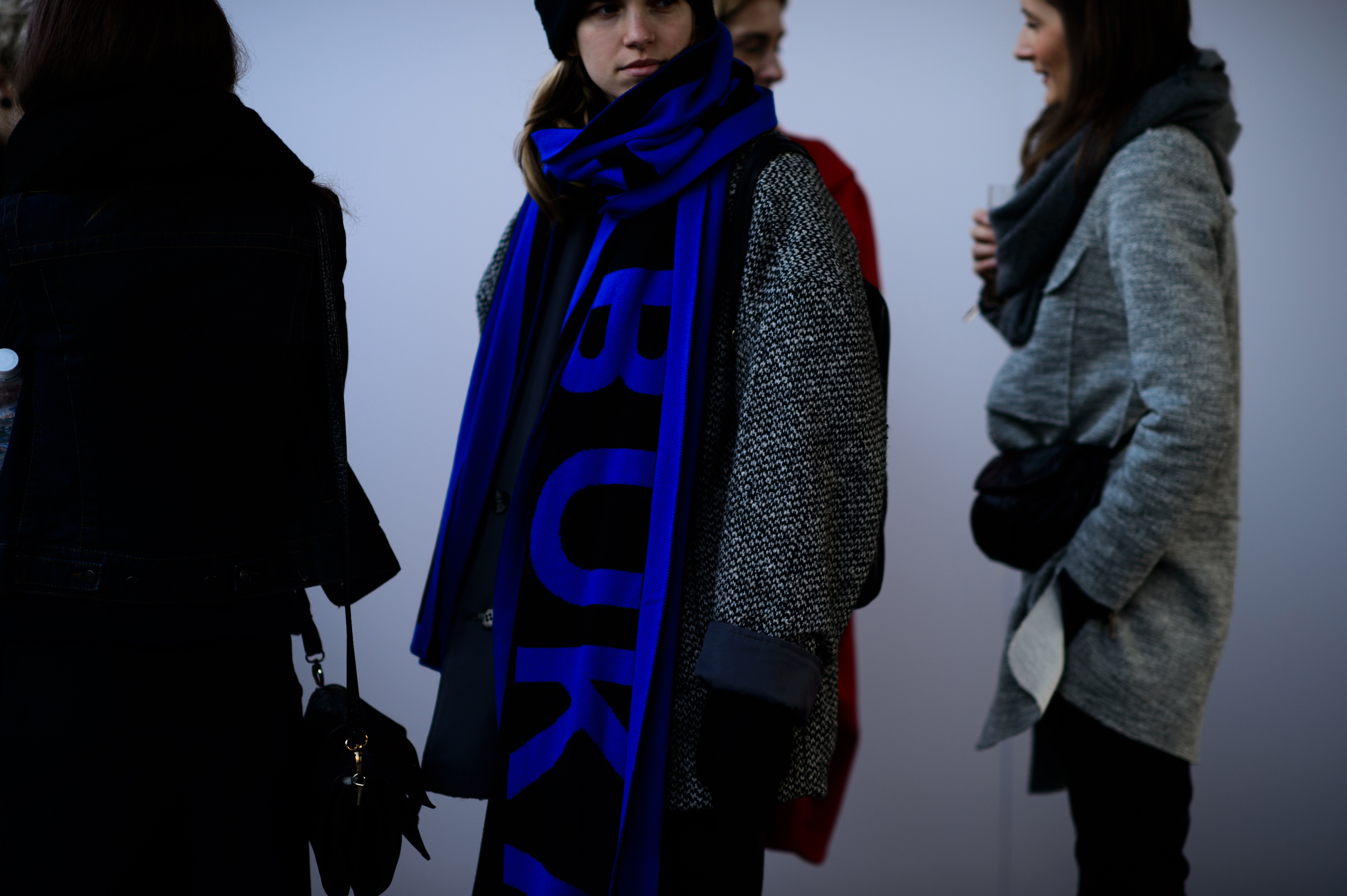 Woman wearing big blue scarf