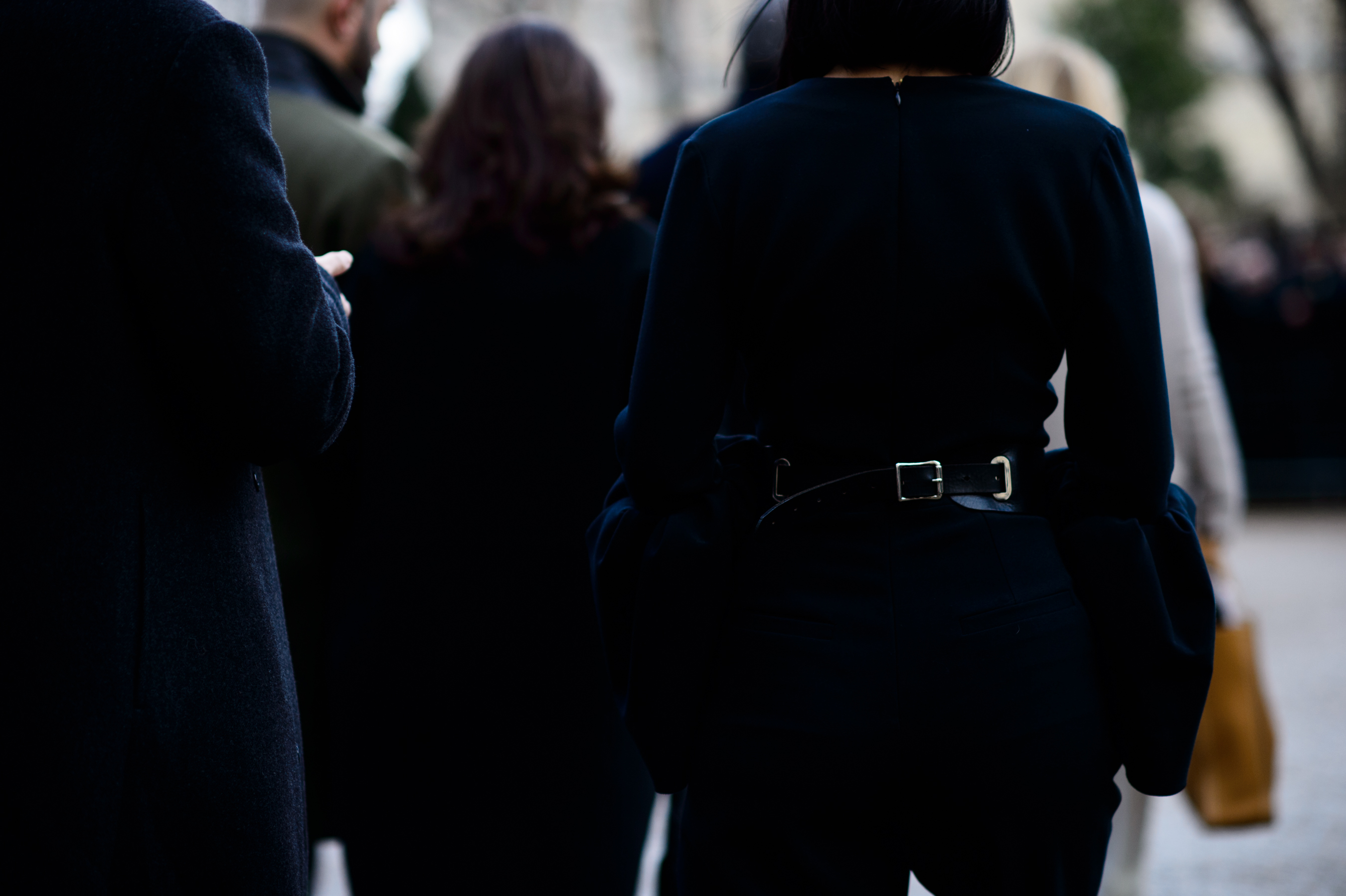 Woman from rear in black outfit