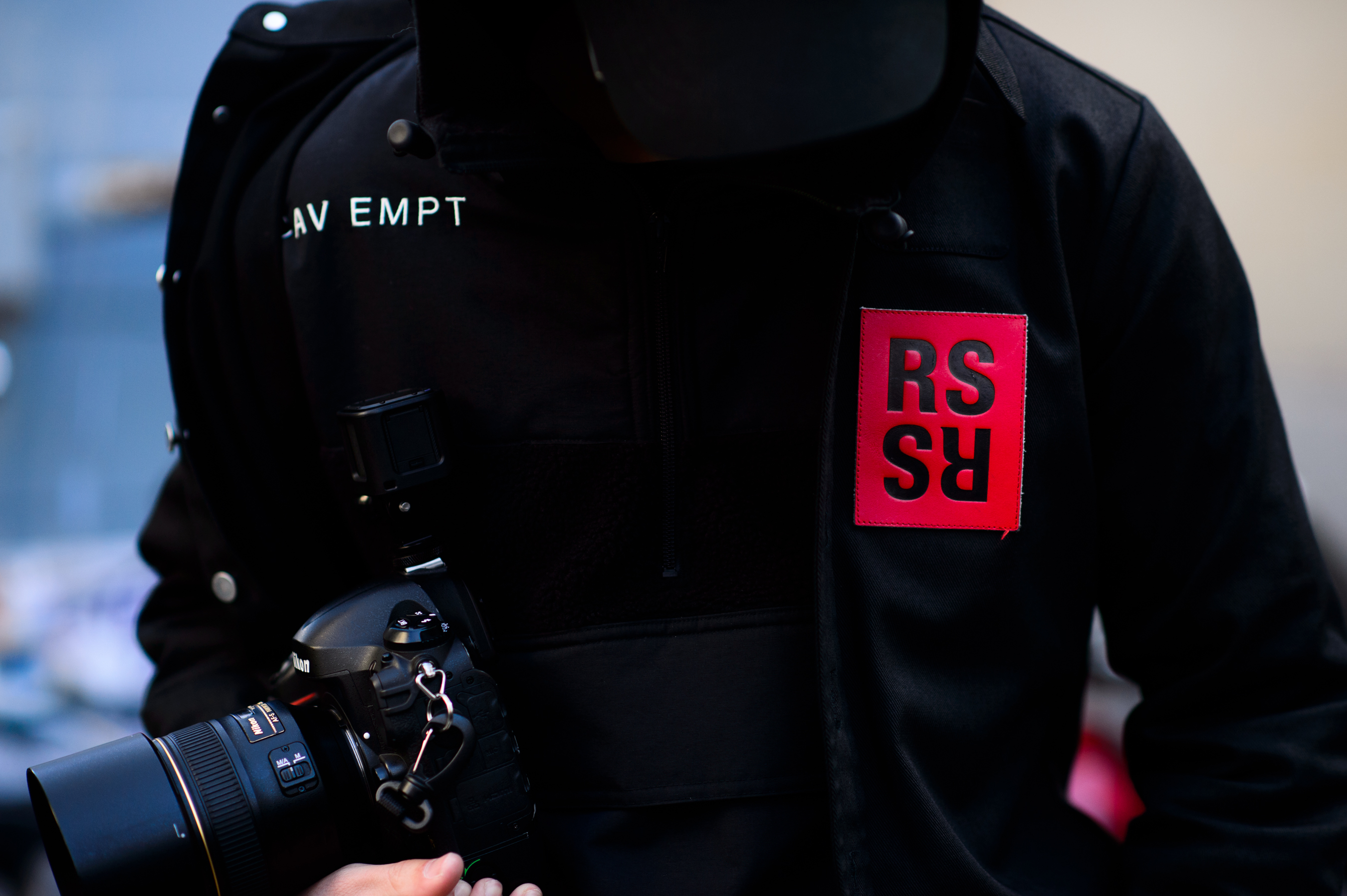American photographer wearing denim with red patch