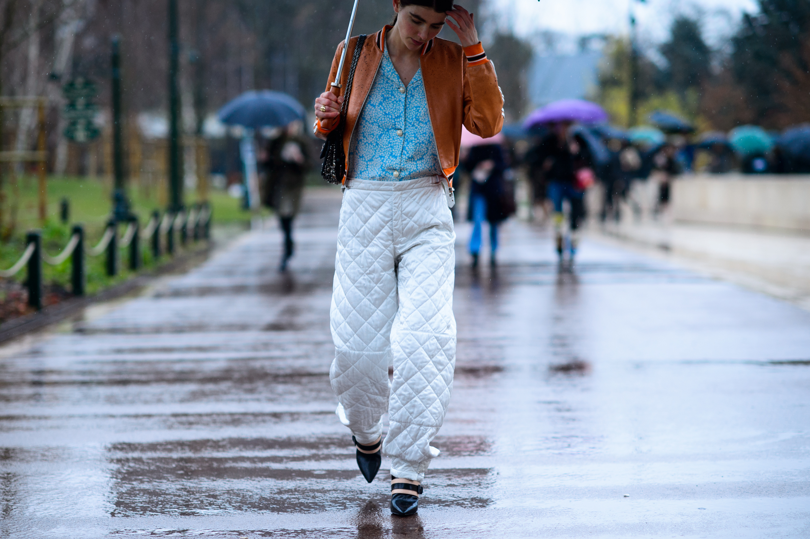 Woman wearing white quilted trousers