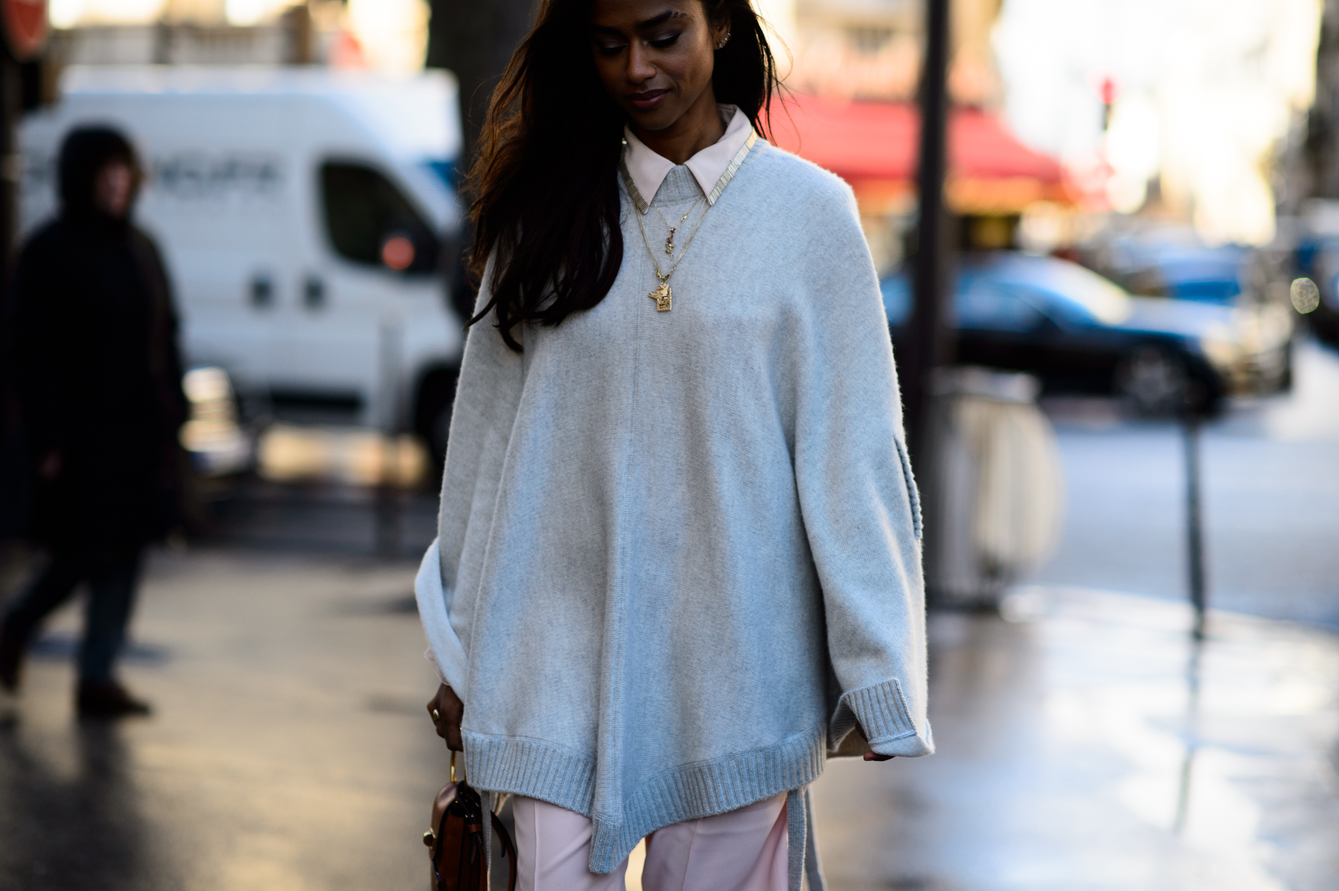 American producer wearing blue long top