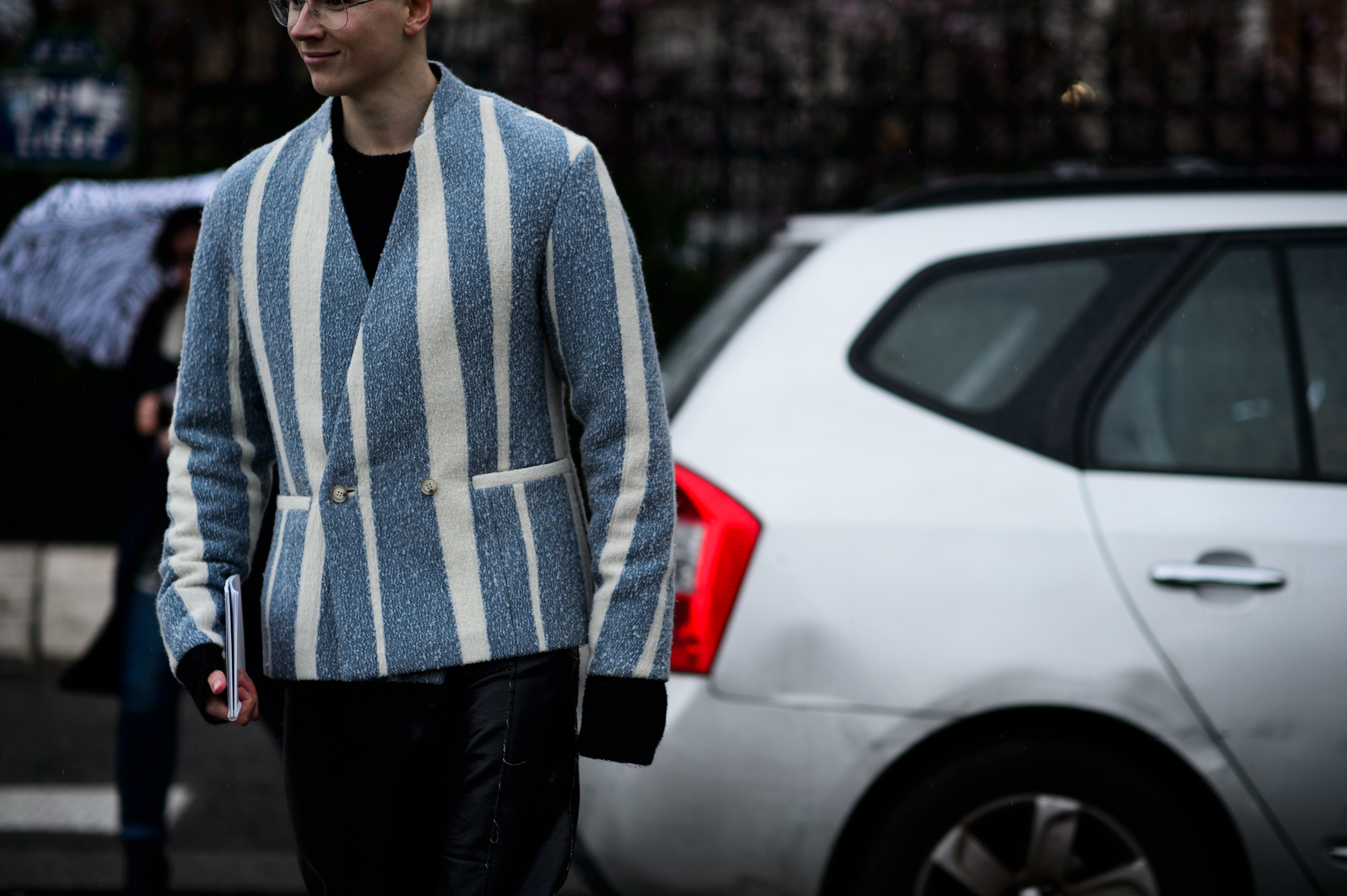 Man wearing blue striped jacket