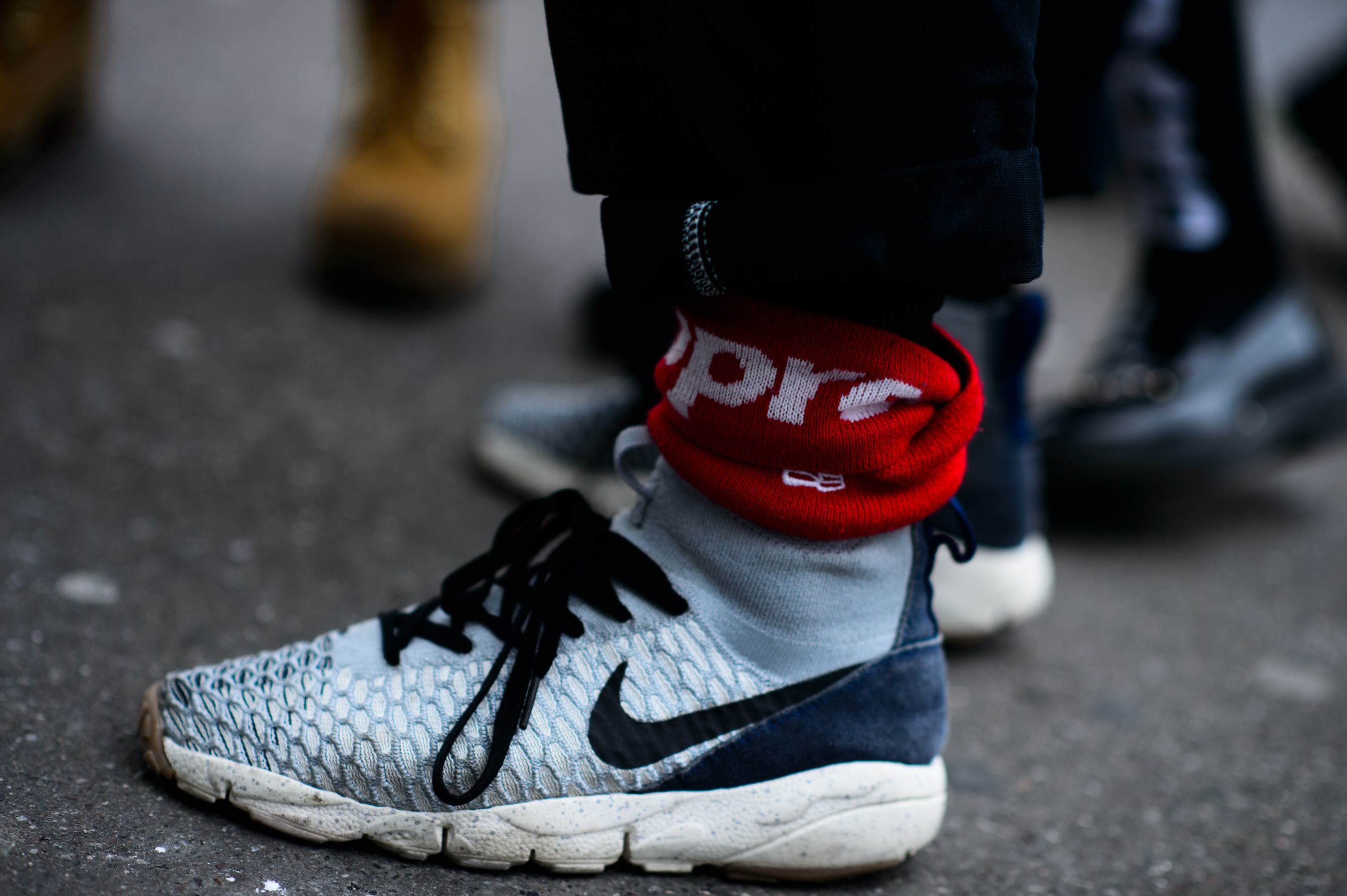 Closeup of blue sports shoes with red headband