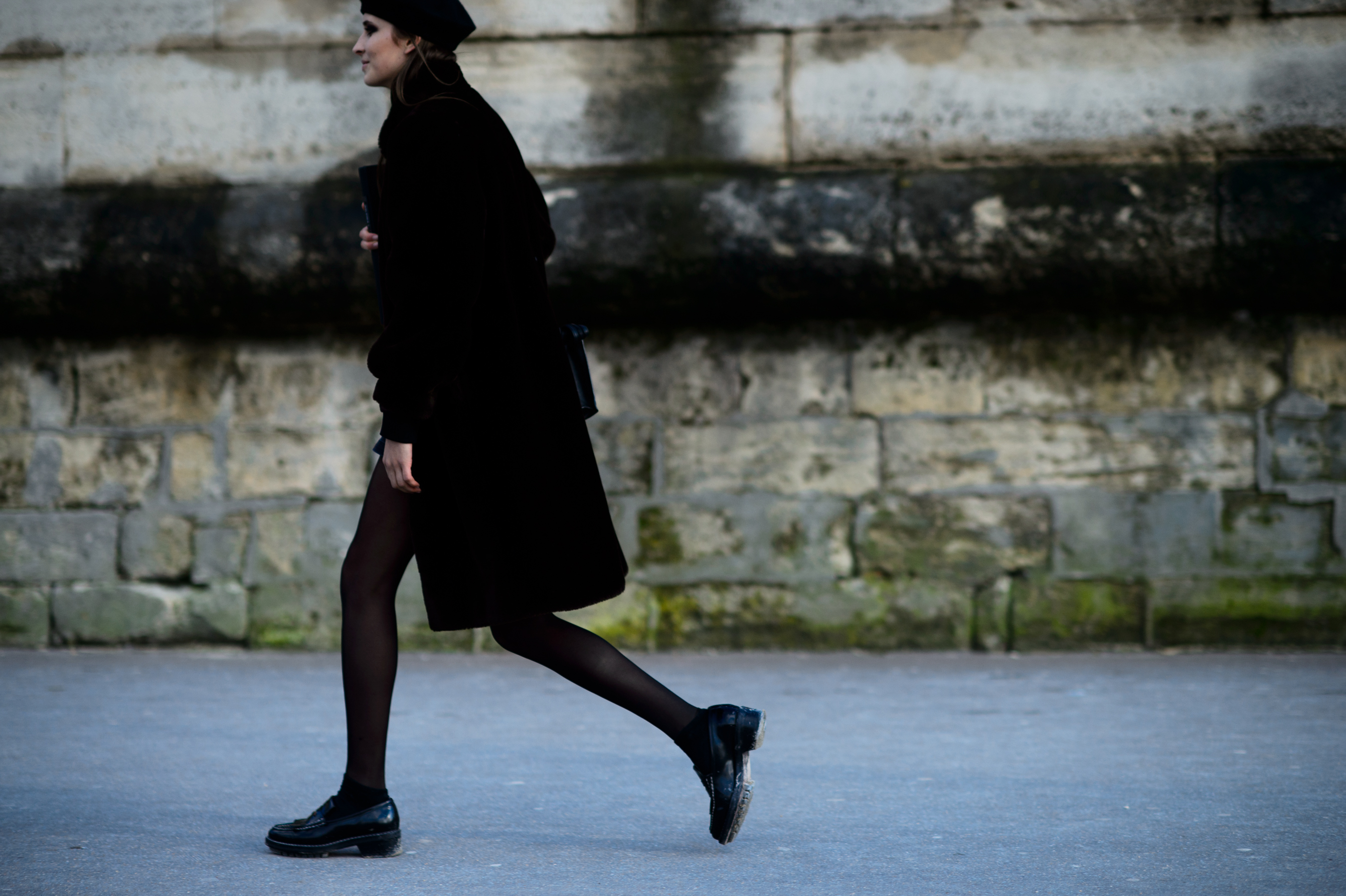 Brazilian model walking in black fur coat