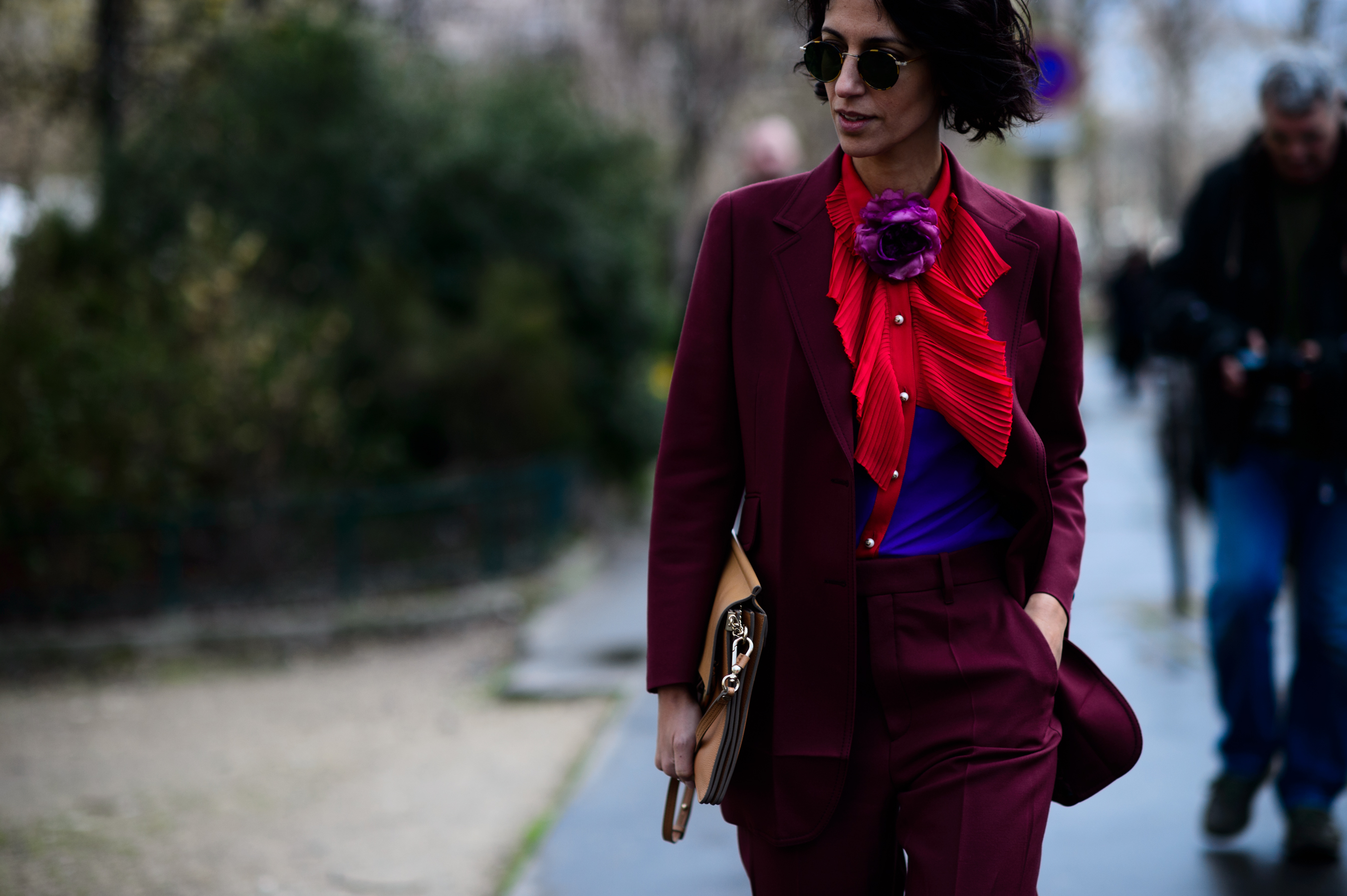 Woman wearing red and purple outfit