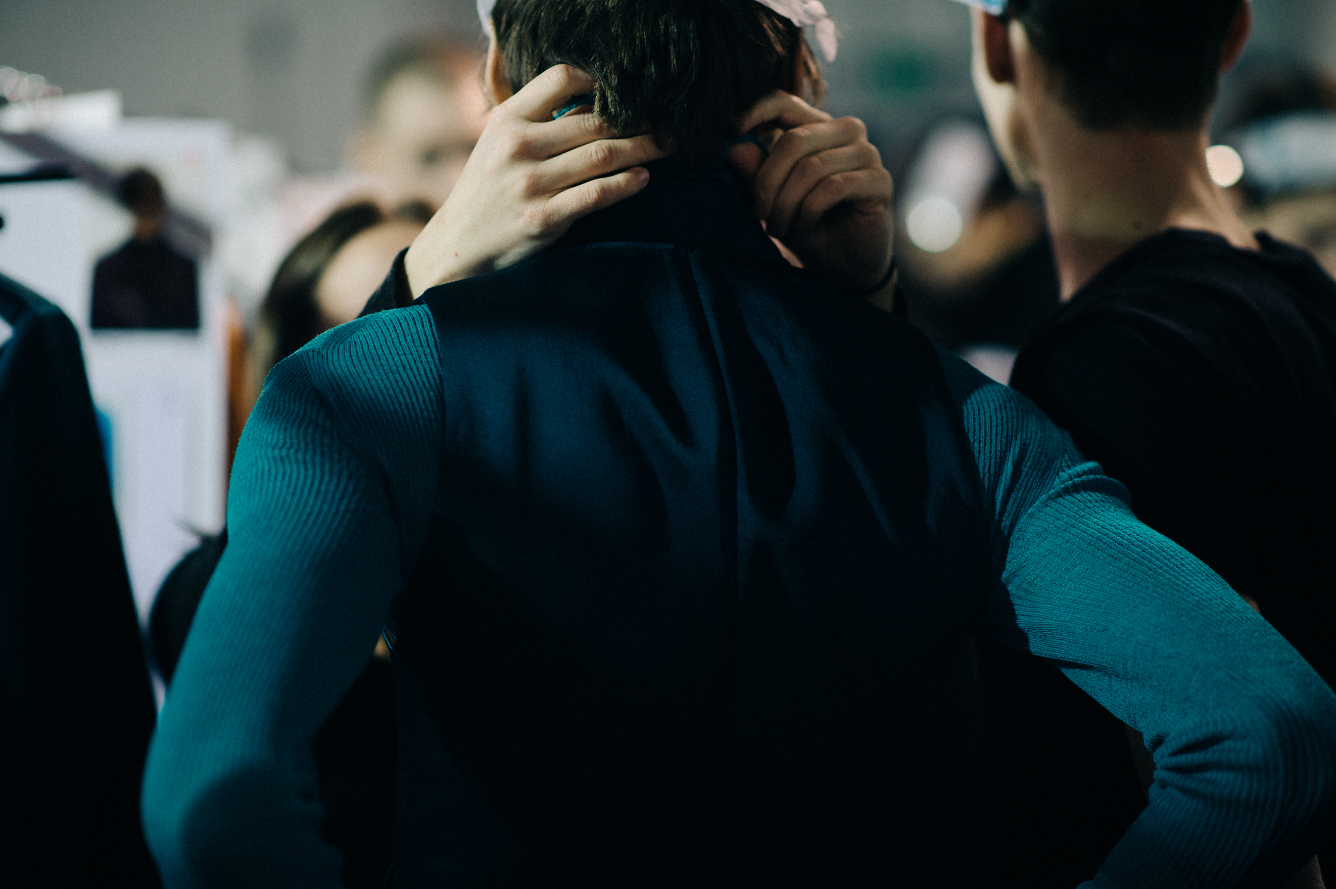 Male model getting dressed