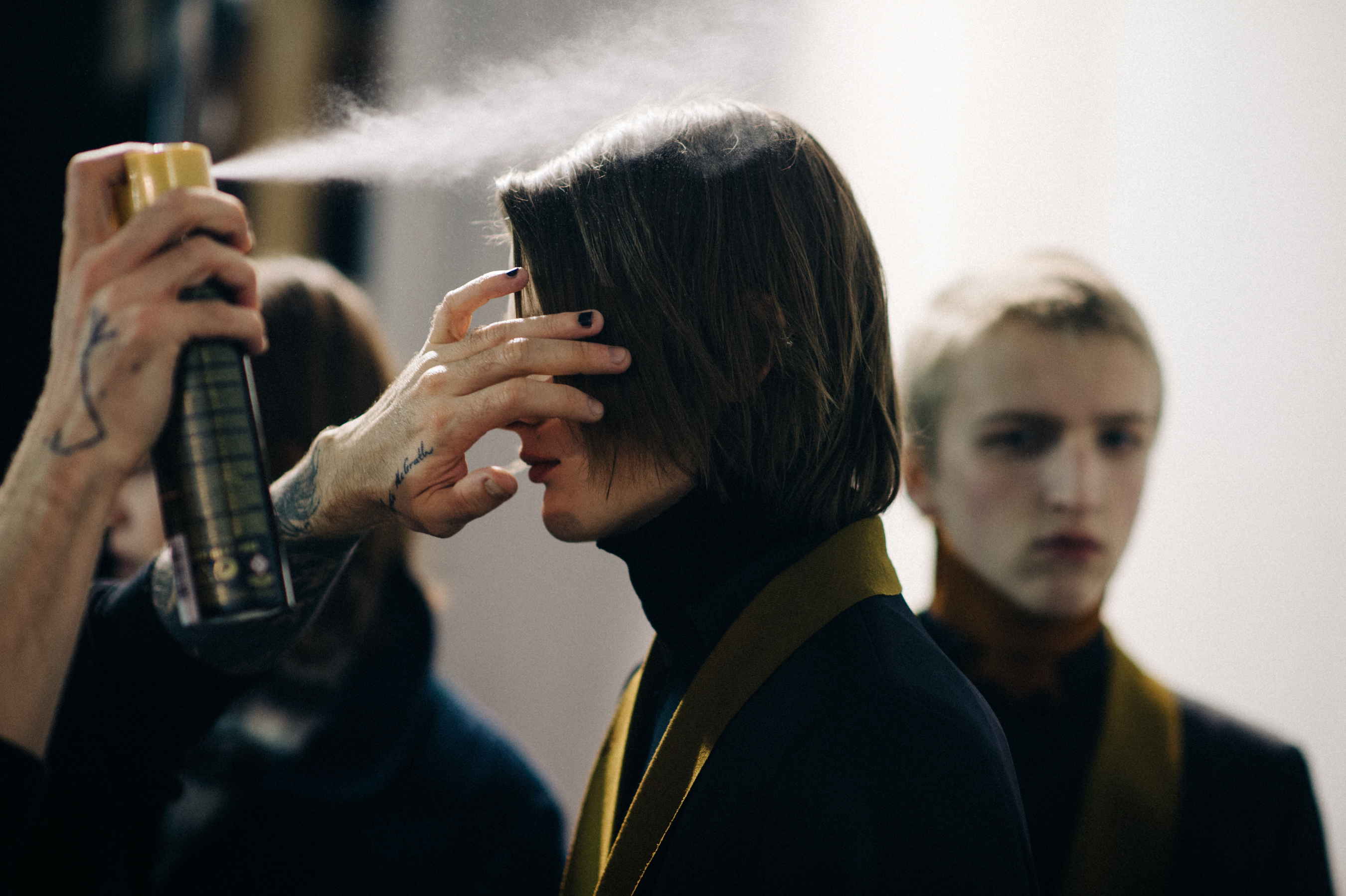 Male model getting hair sprayed
